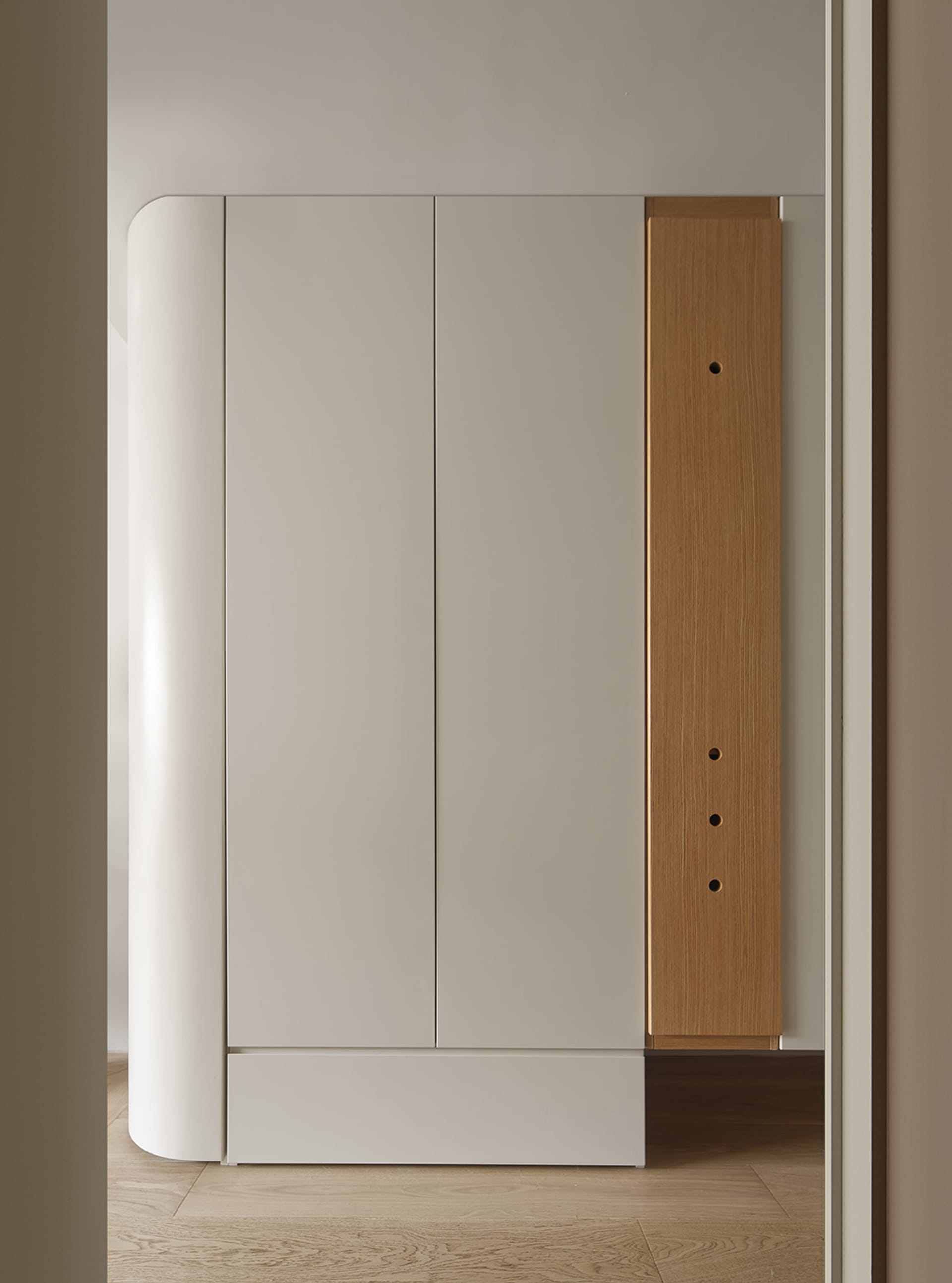 Modern minimalist wardrobe cabinet with white oak and white matte finish.