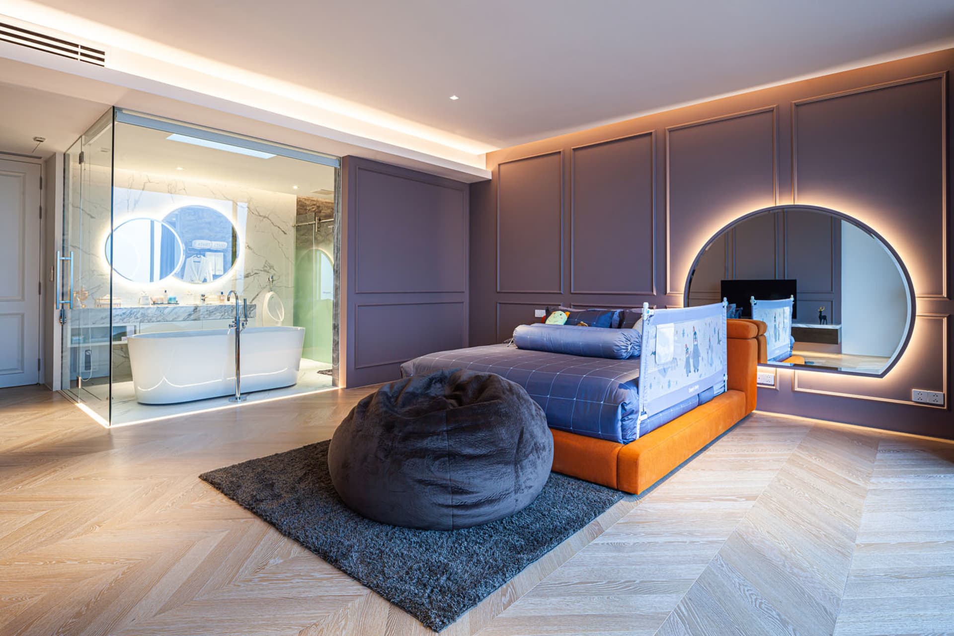 A modern contemporary bedroom featuring a wooden floor, minimalist design, and a comfortable bed.