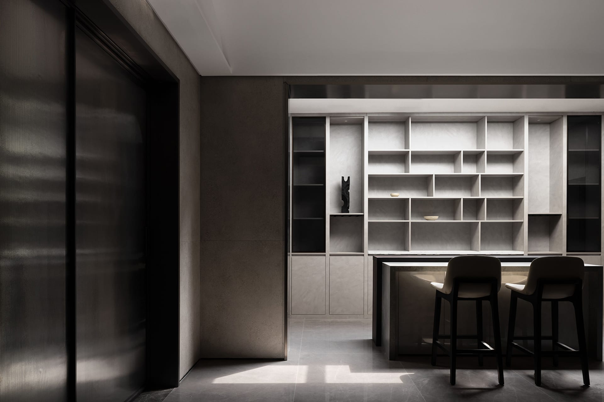 A modern interior featuring concrete, glass, and metal materials.