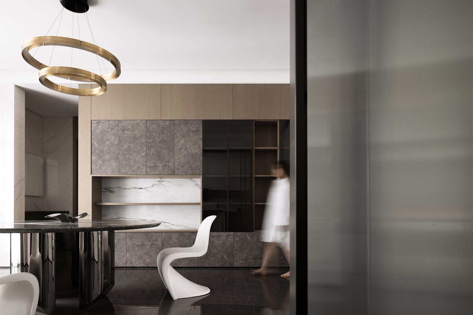 A modern interior design featuring a marble floor and contemporary furniture.