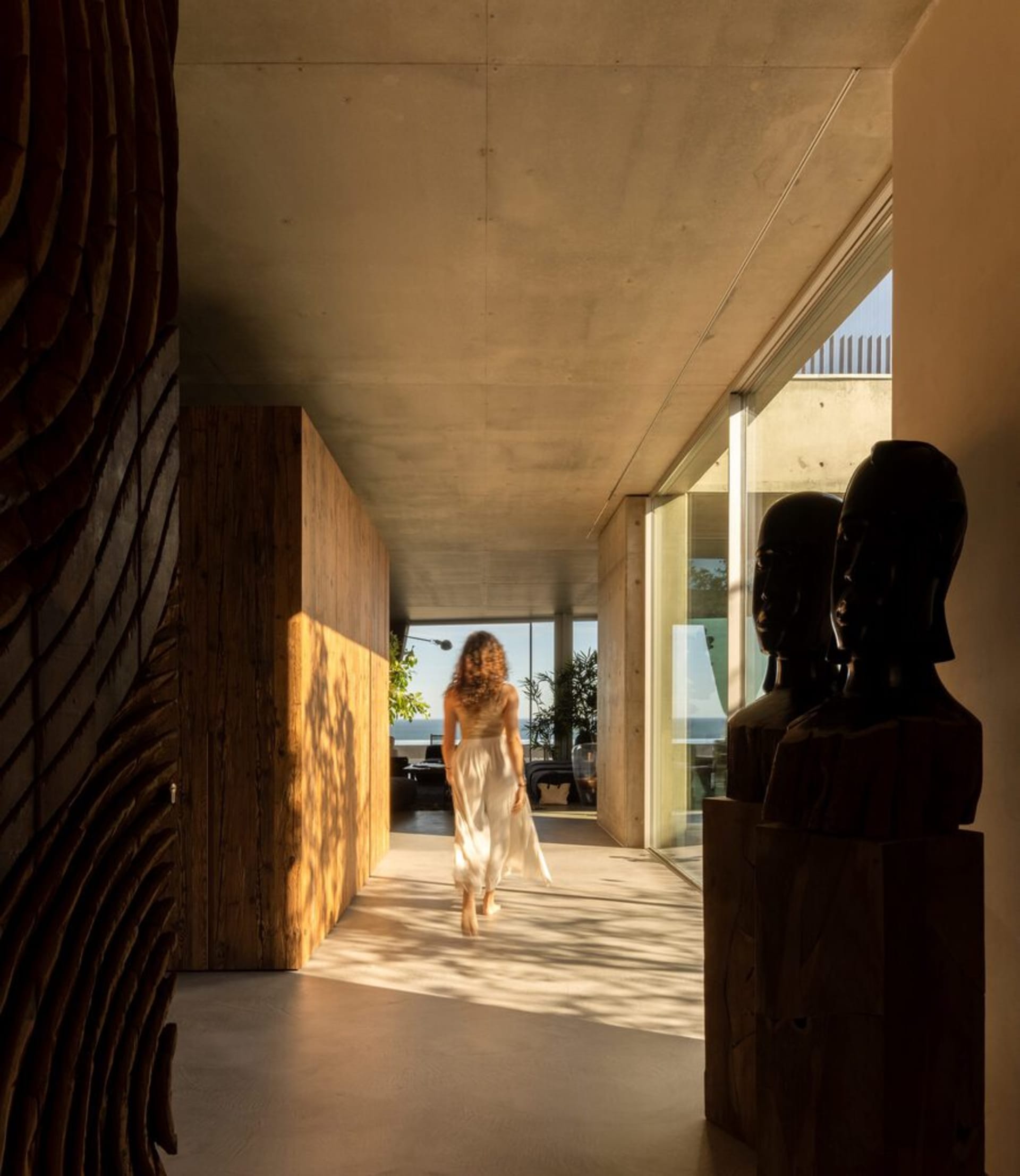 A modern residence featuring a combination of concrete and wood materials.