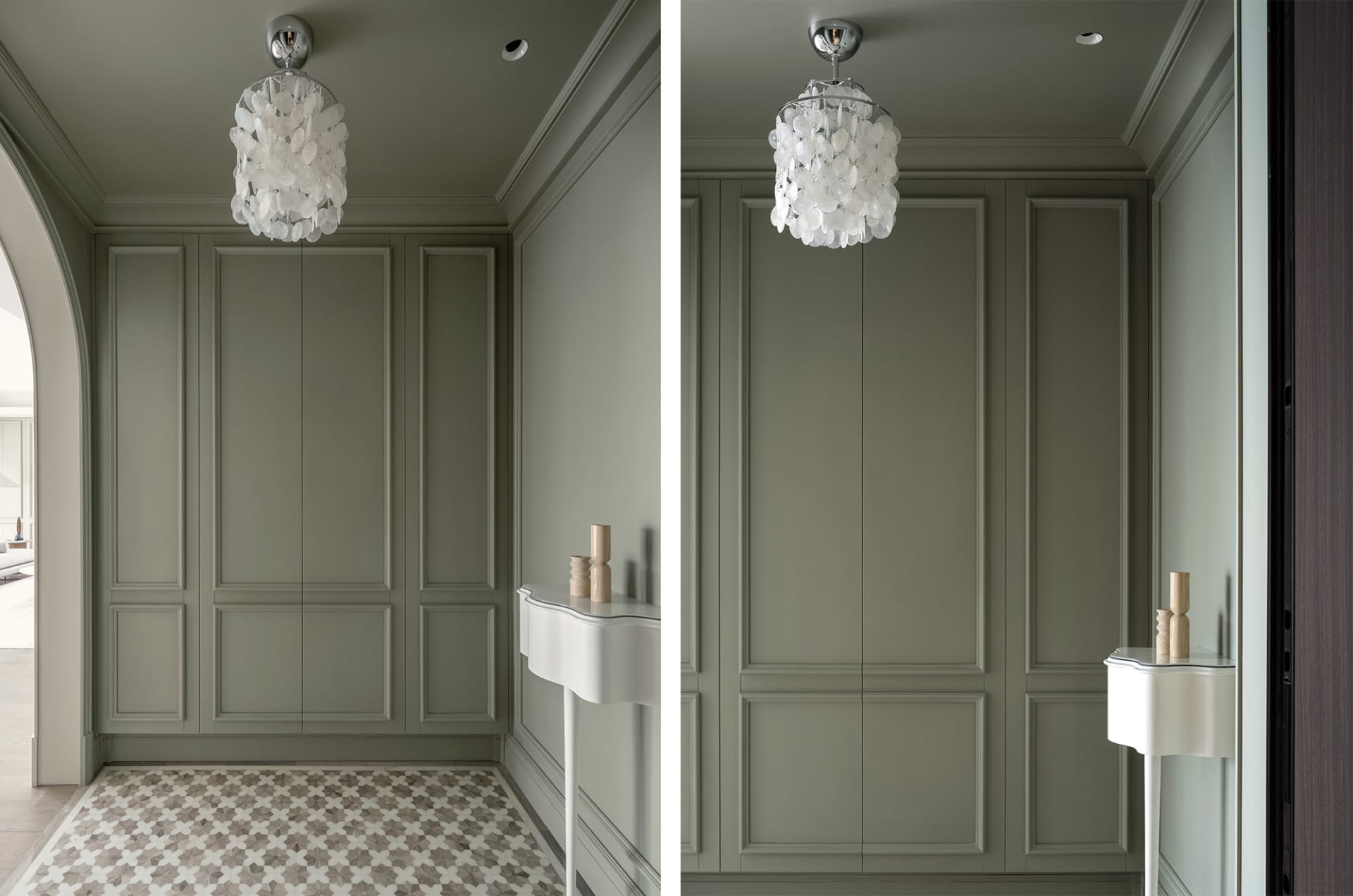 View of an elegant entrance featuring metallic shell lighting panels on the wall.