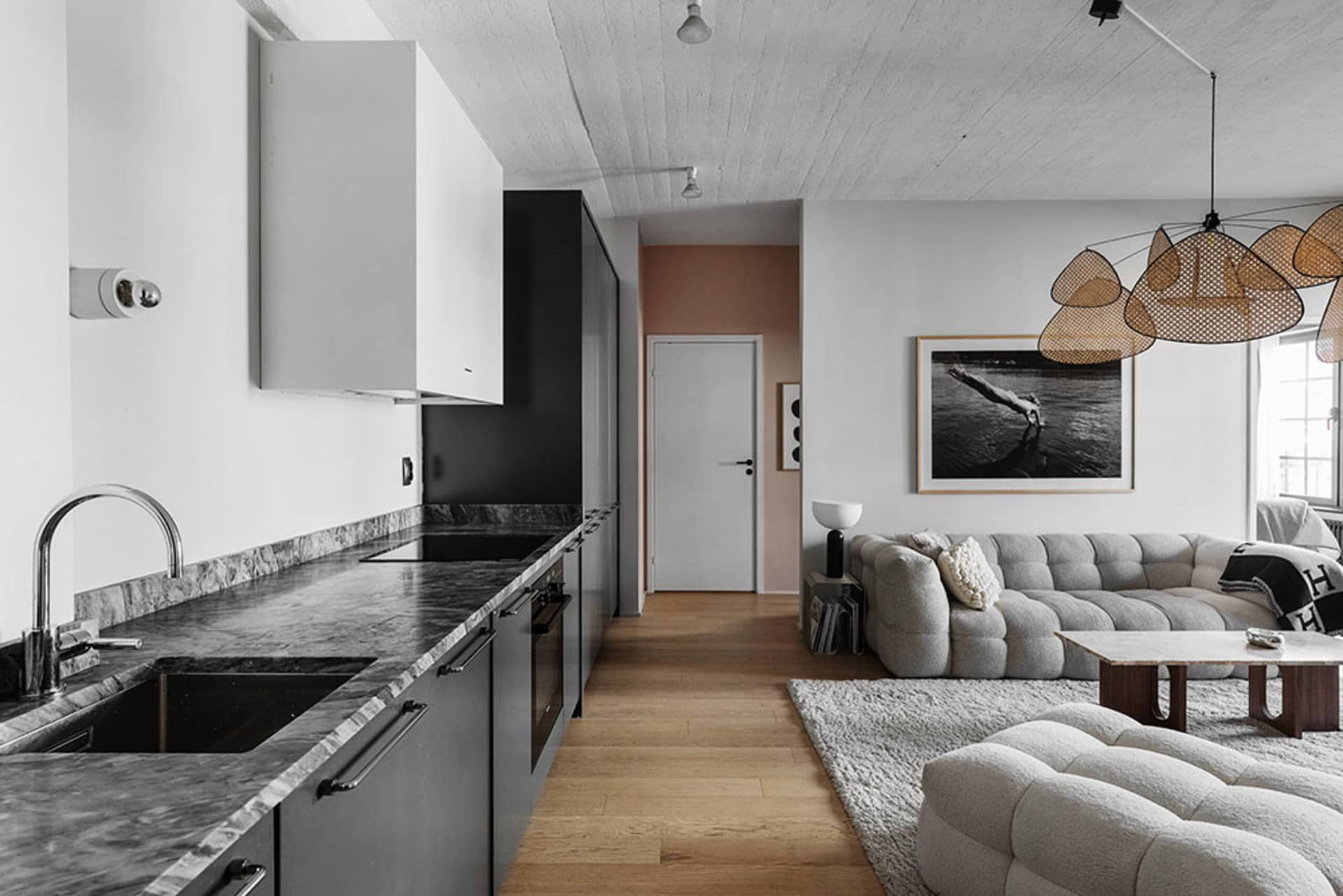 modern living space with marble countertops and beige sofa