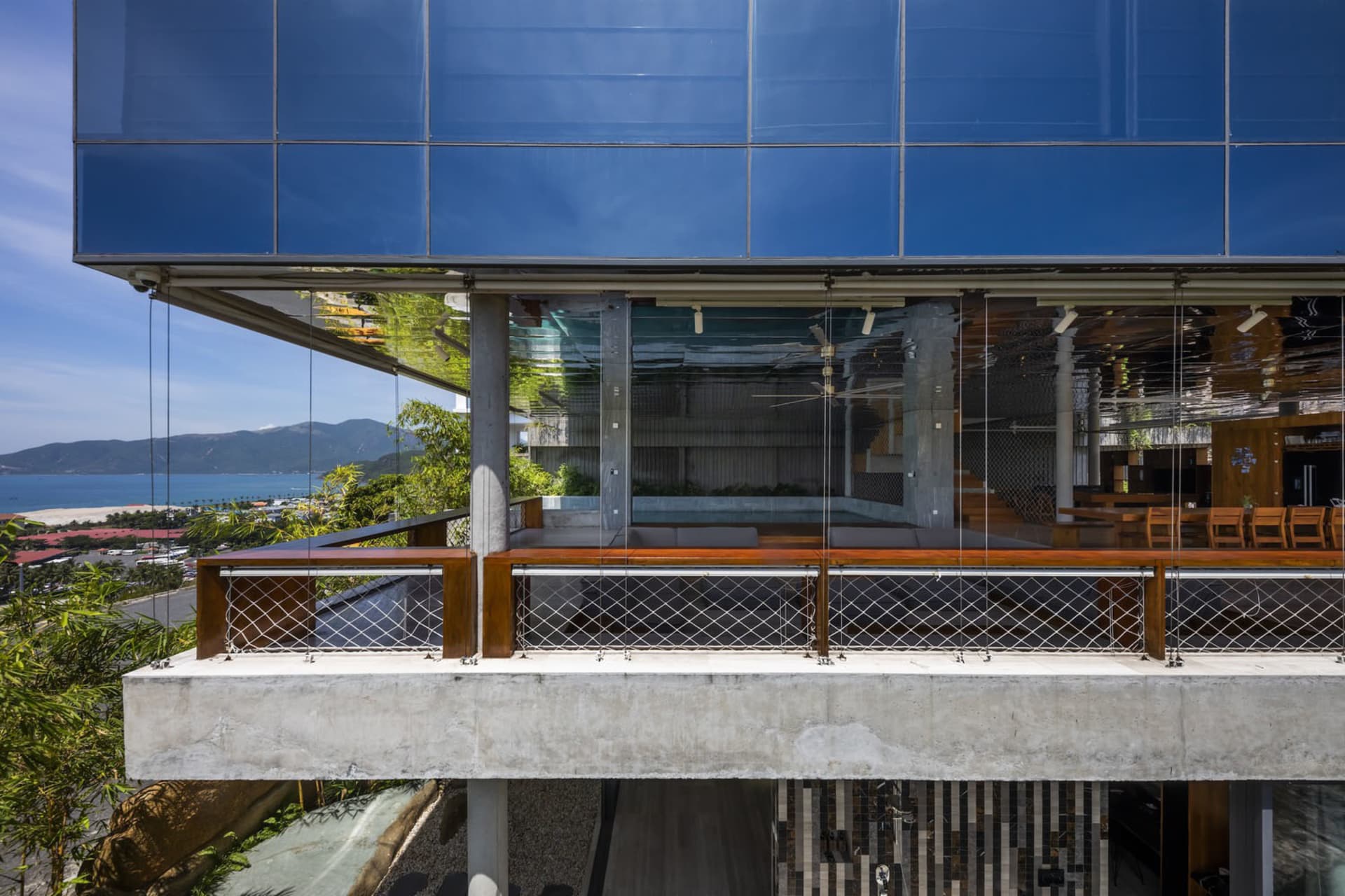 A modern building featuring extensive glass and concrete materials.
