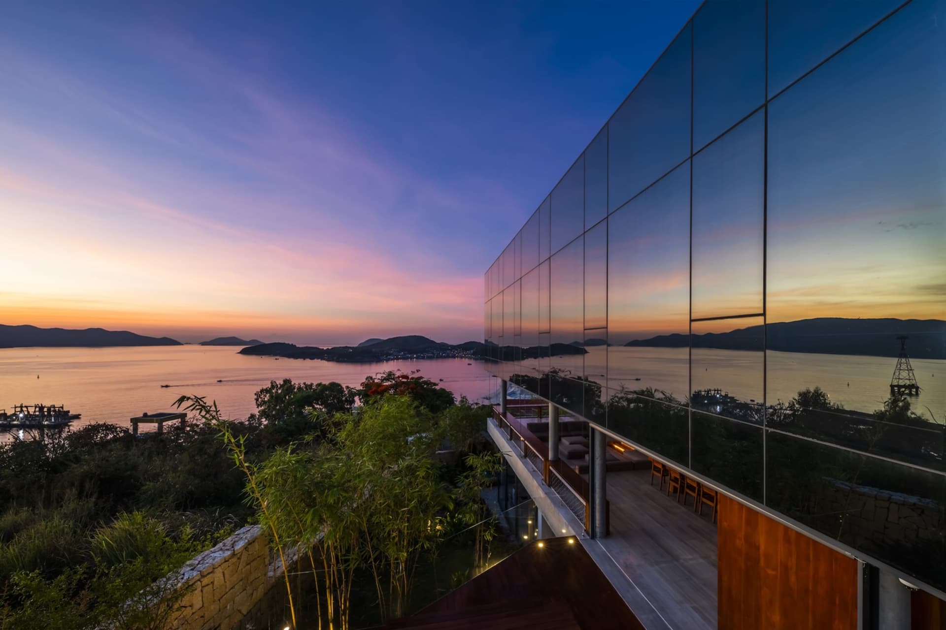 Modern residential exterior featuring a glass wall