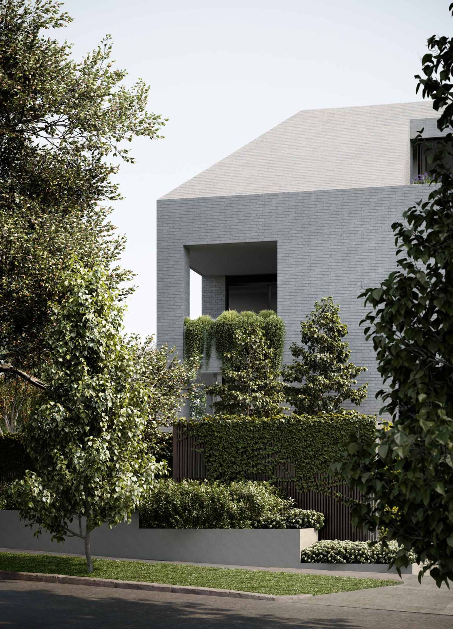 Modern house with brick exterior, large windows, and greenery.