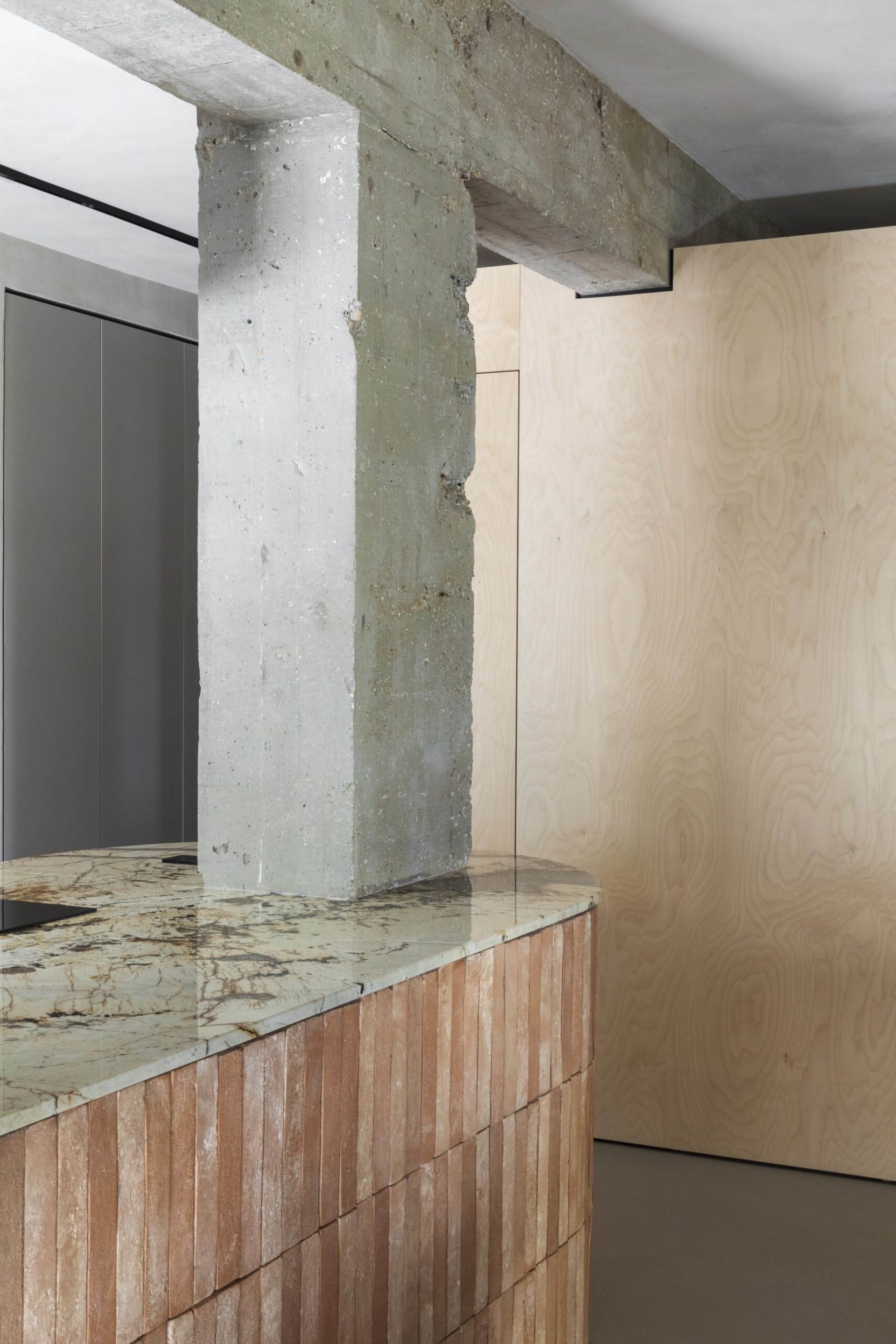 Modern interior with concrete and wooden elements.