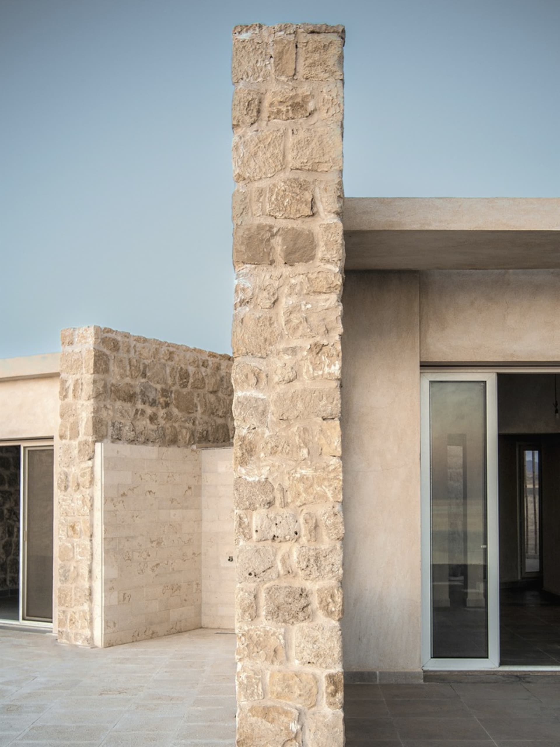 Modern architectural design featuring natural stone materials and contemporary style.