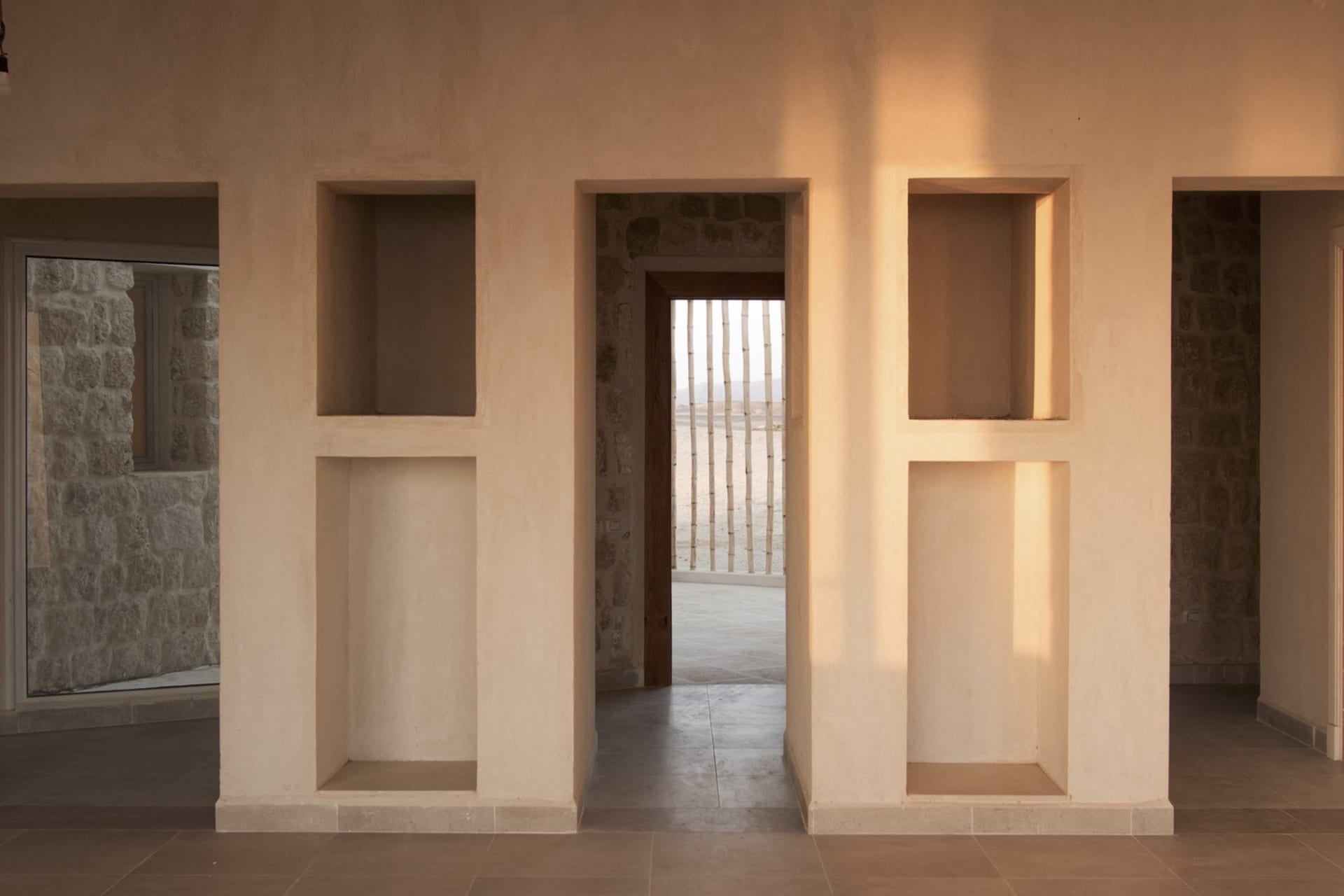 Modern interior design featuring concrete and stone materials.