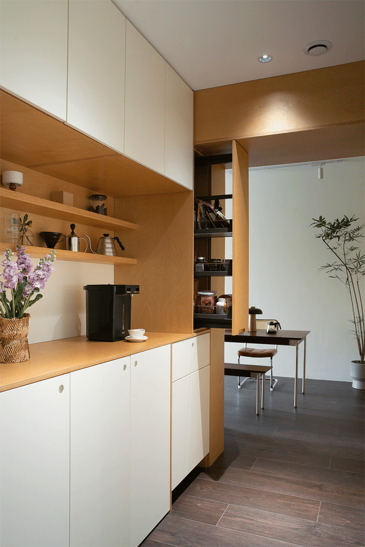 Modern residential kitchen featuring wooden board countertops and minimalist design.