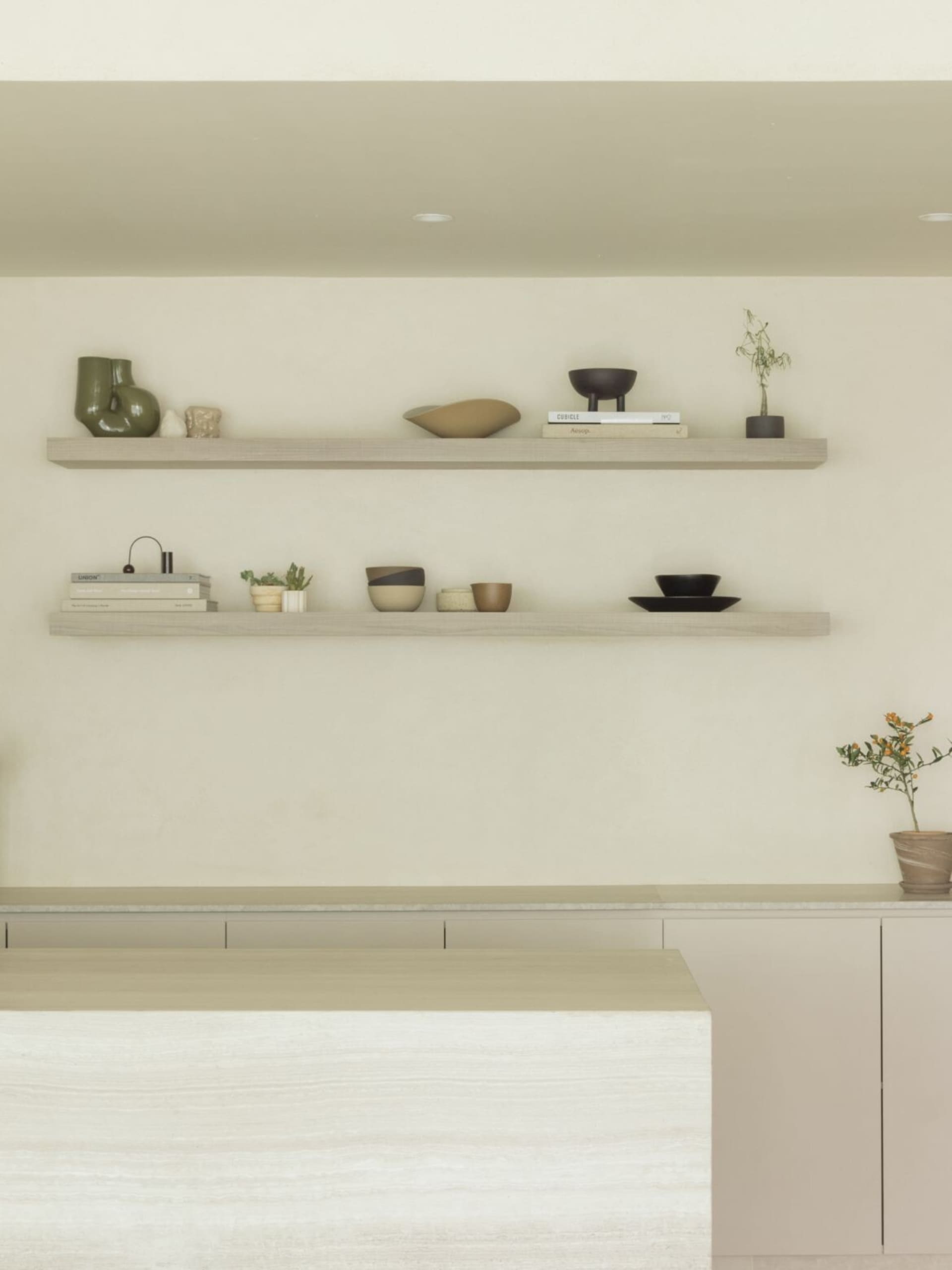 A minimalist interior space featuring a wooden floating shelf, decorative items, and plants.