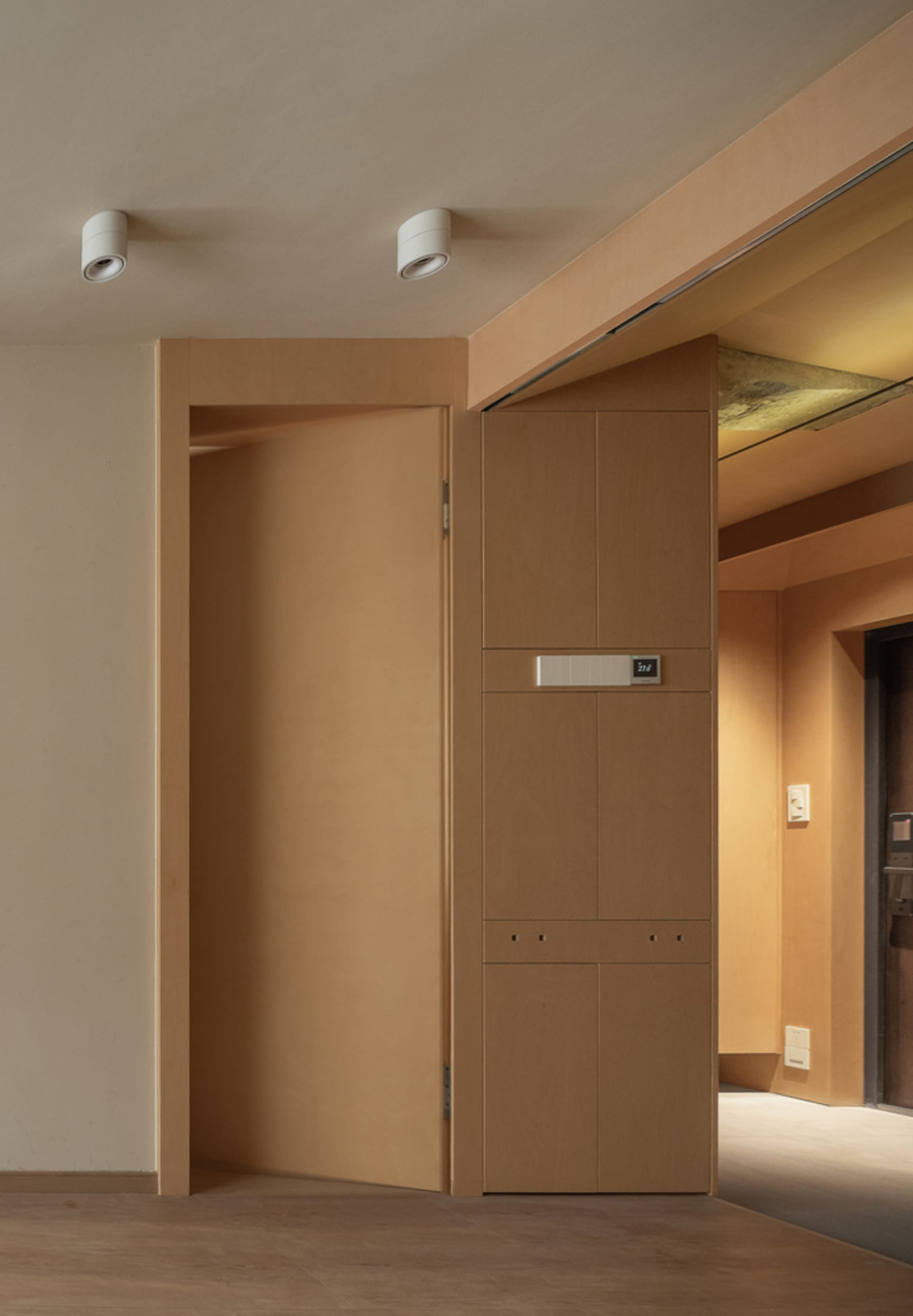 Modern, minimalist wooden cabinet in a living room interior design.