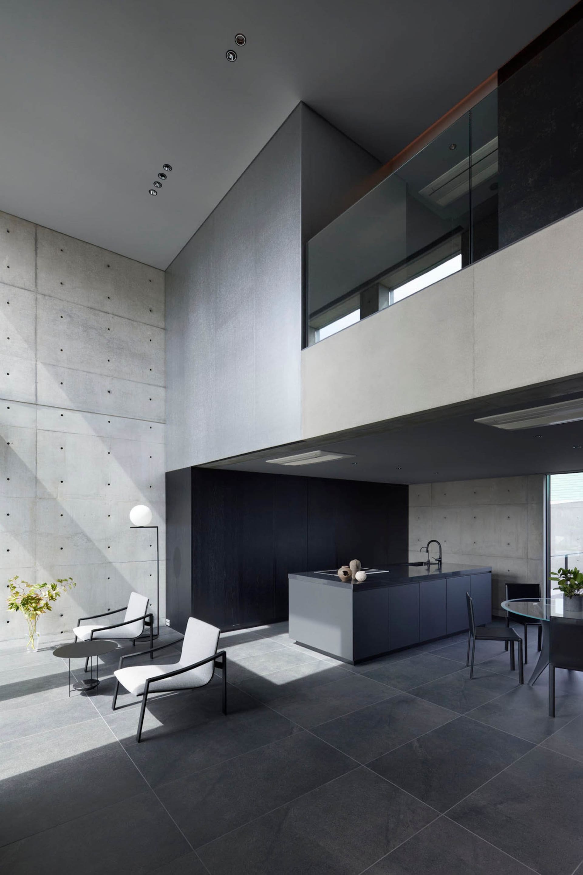 Modern interior design featuring concrete walls and flooring.