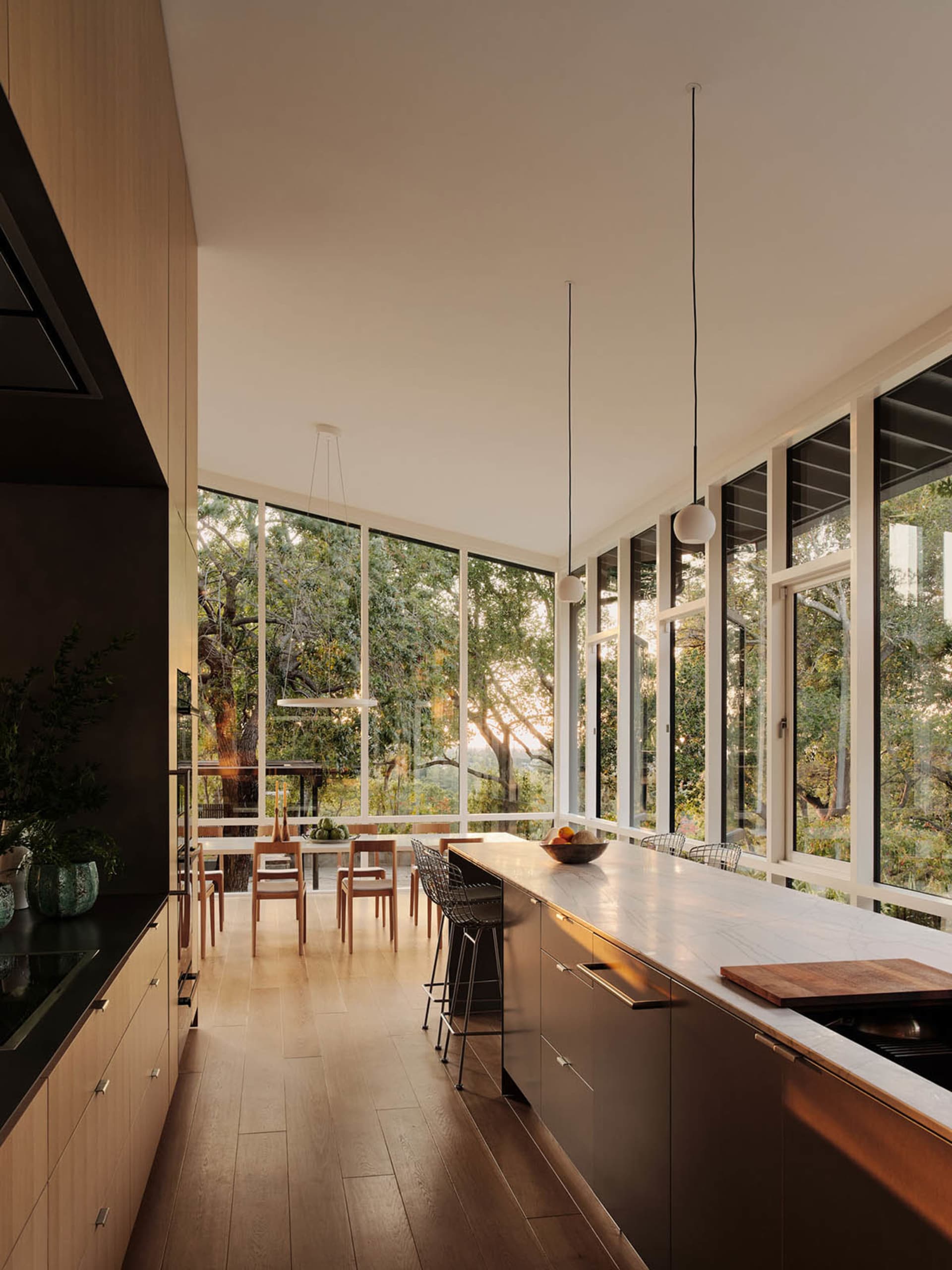 Modern kitchen with marble island and wooden cabinets