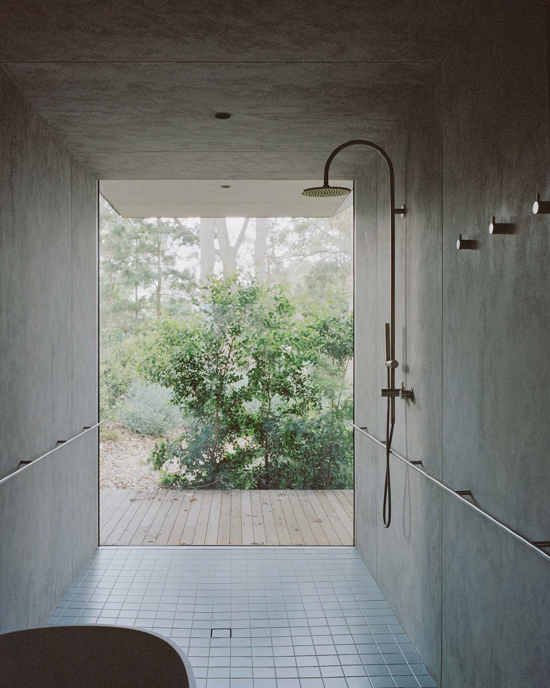 Modern bathroom with concrete walls and minimalist design.