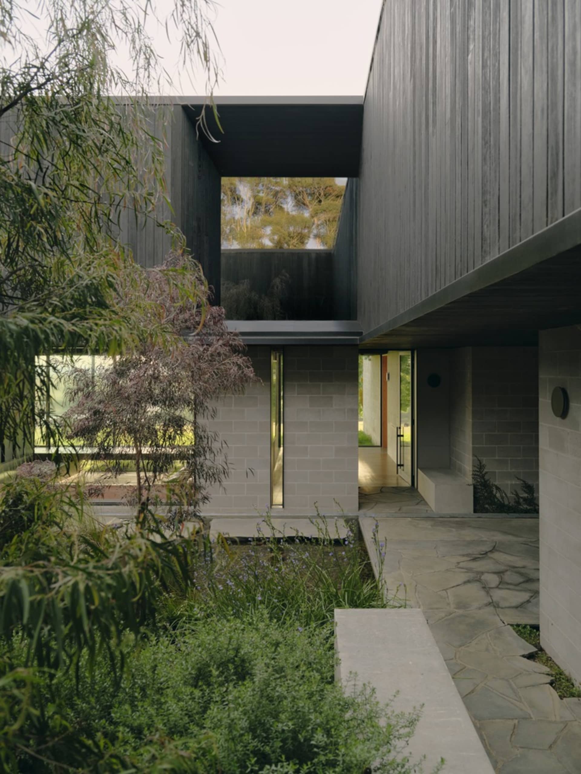 A modern exterior architectural design featuring concrete materials.
