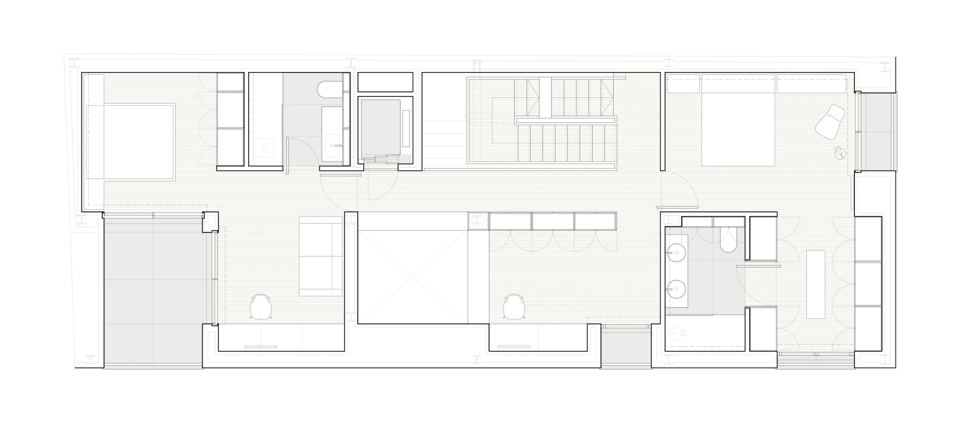 A modern residential floor plan showing wooden flooring and minimalist design.