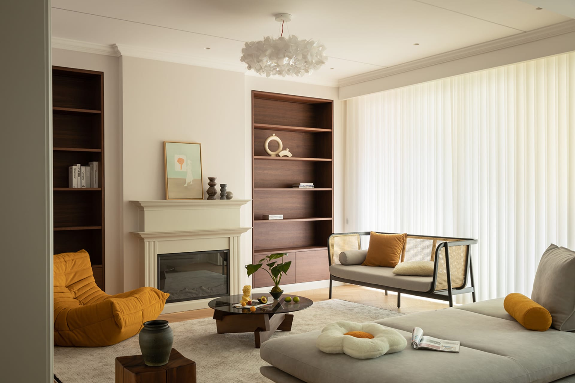A modern interior design living room with a fireplace, bookshelves, and comfortable seating.