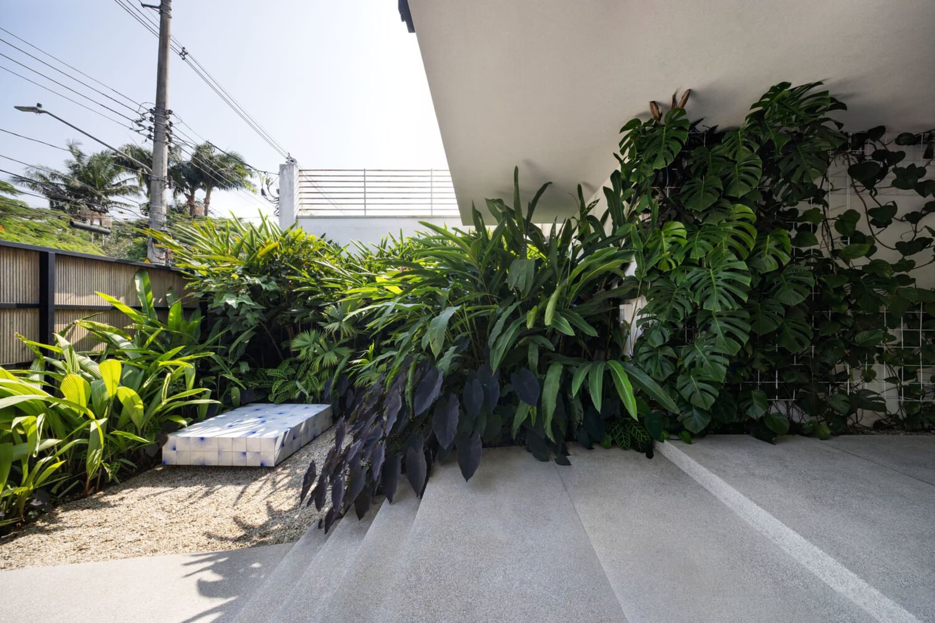 A modern interior living space featuring concrete walls and floor.