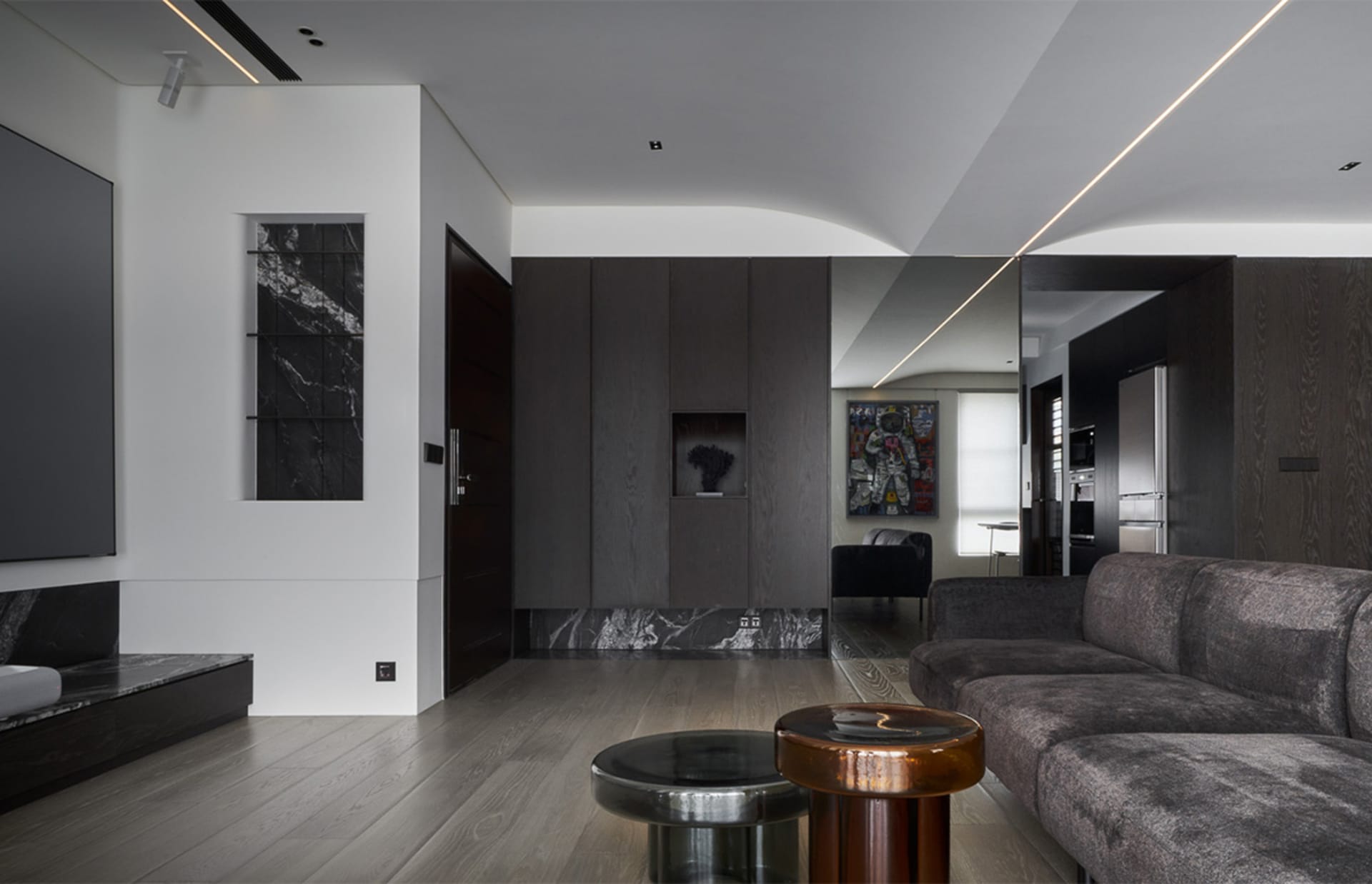 A modern living room featuring marble, wooden, and metallic elements.