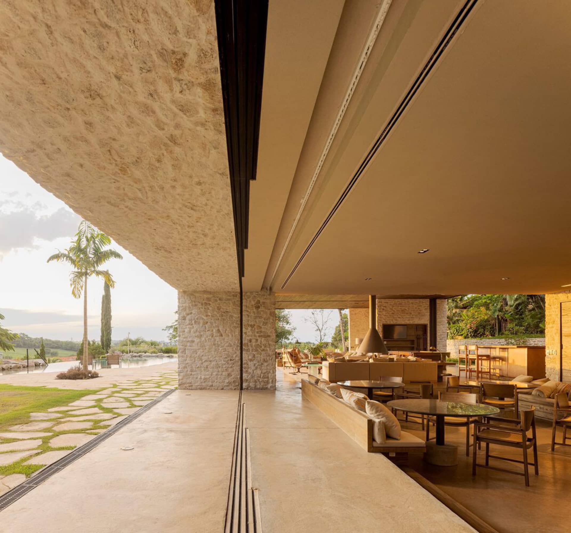 Modern residential interior featuring a concrete floor and walls.