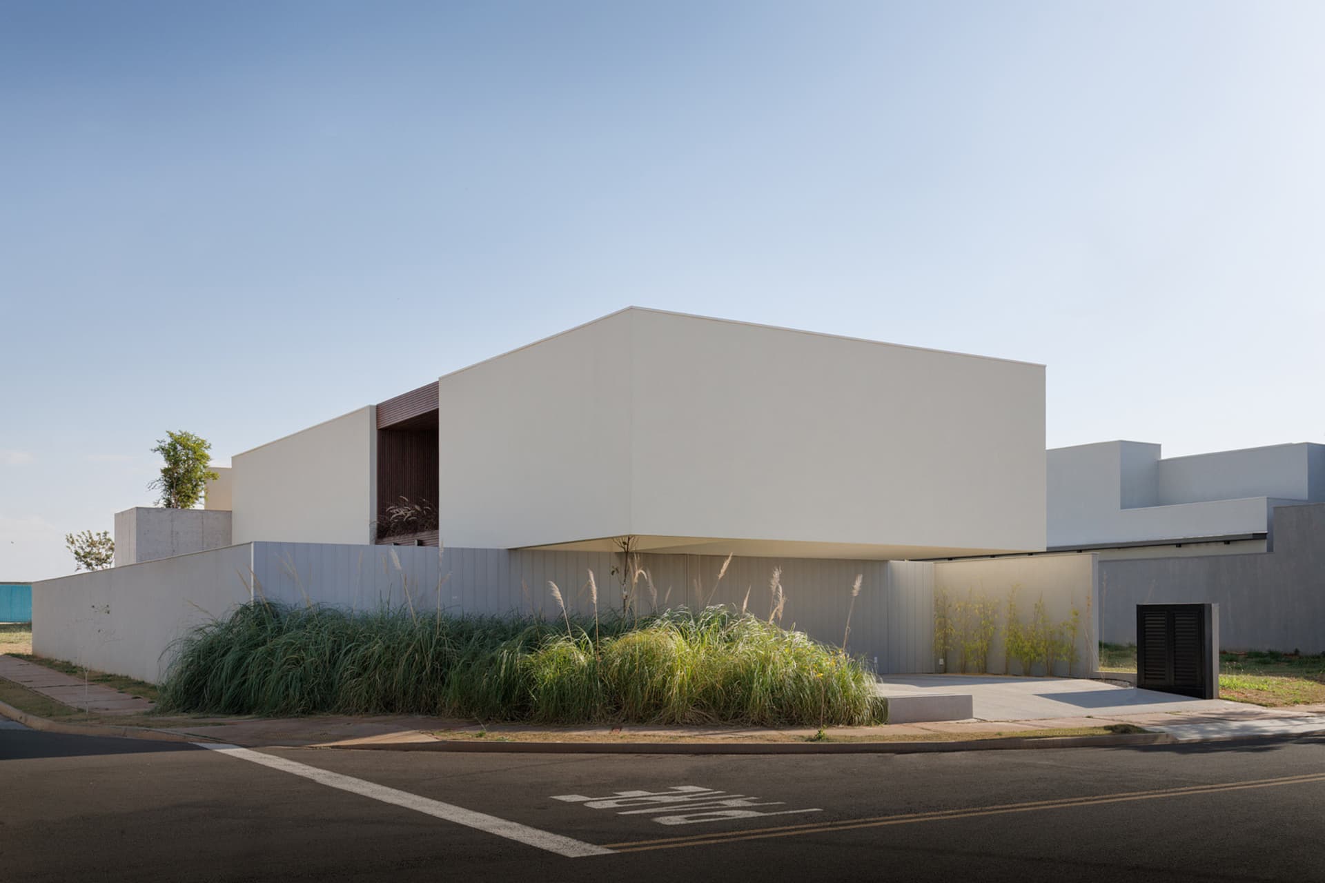 Modern building with a minimalist design featuring concrete materials.