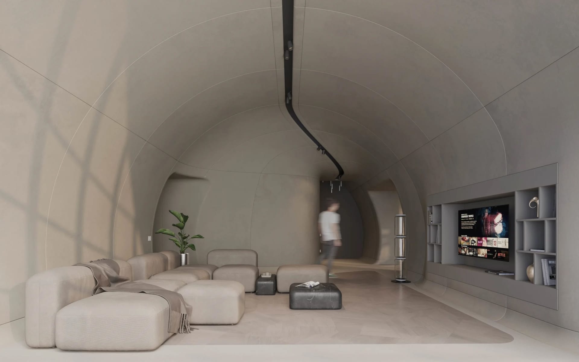 Modern living room with minimalist design, concrete walls, and leather furniture.