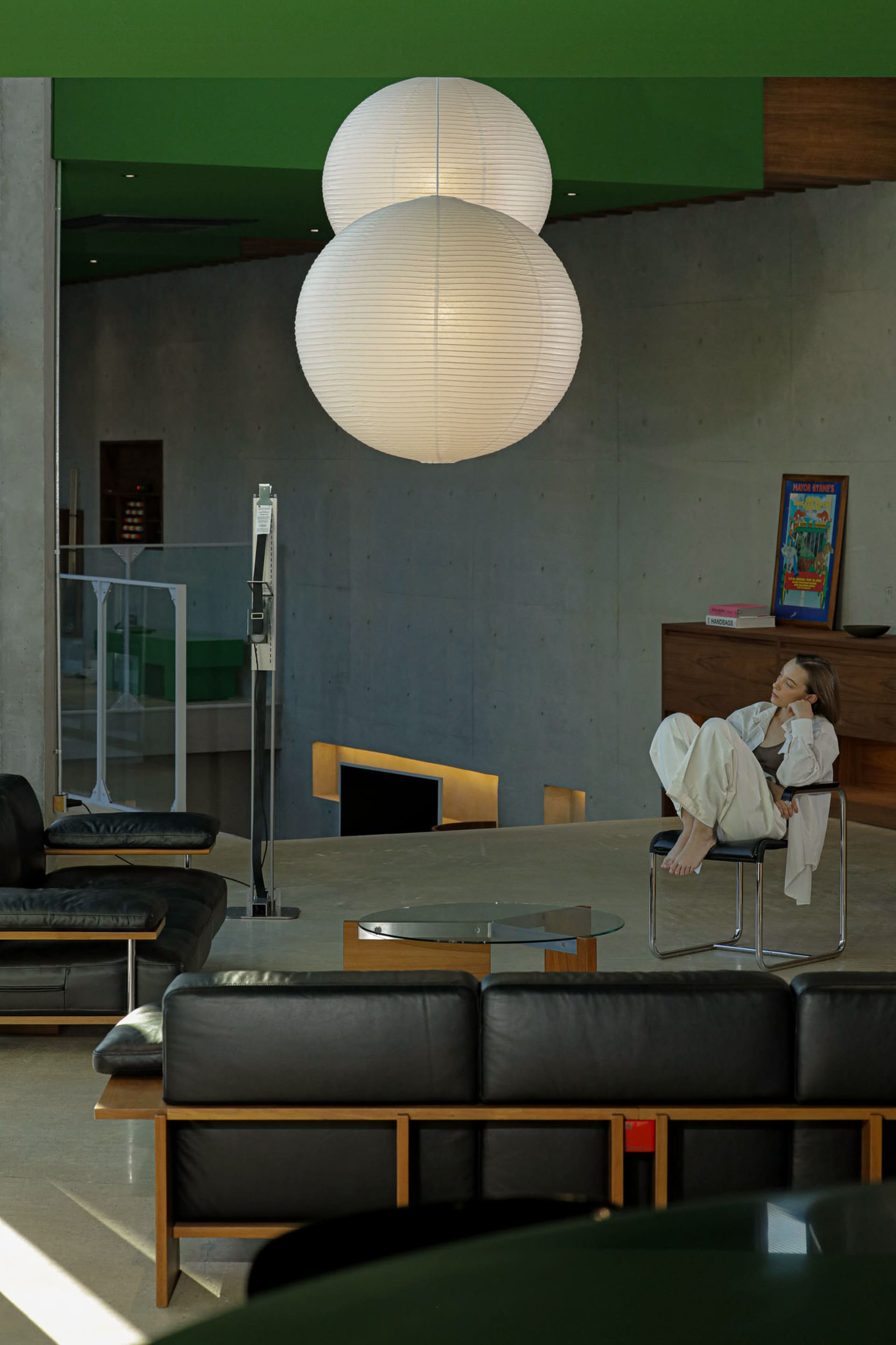 A modern living space featuring concrete and glass materials.
