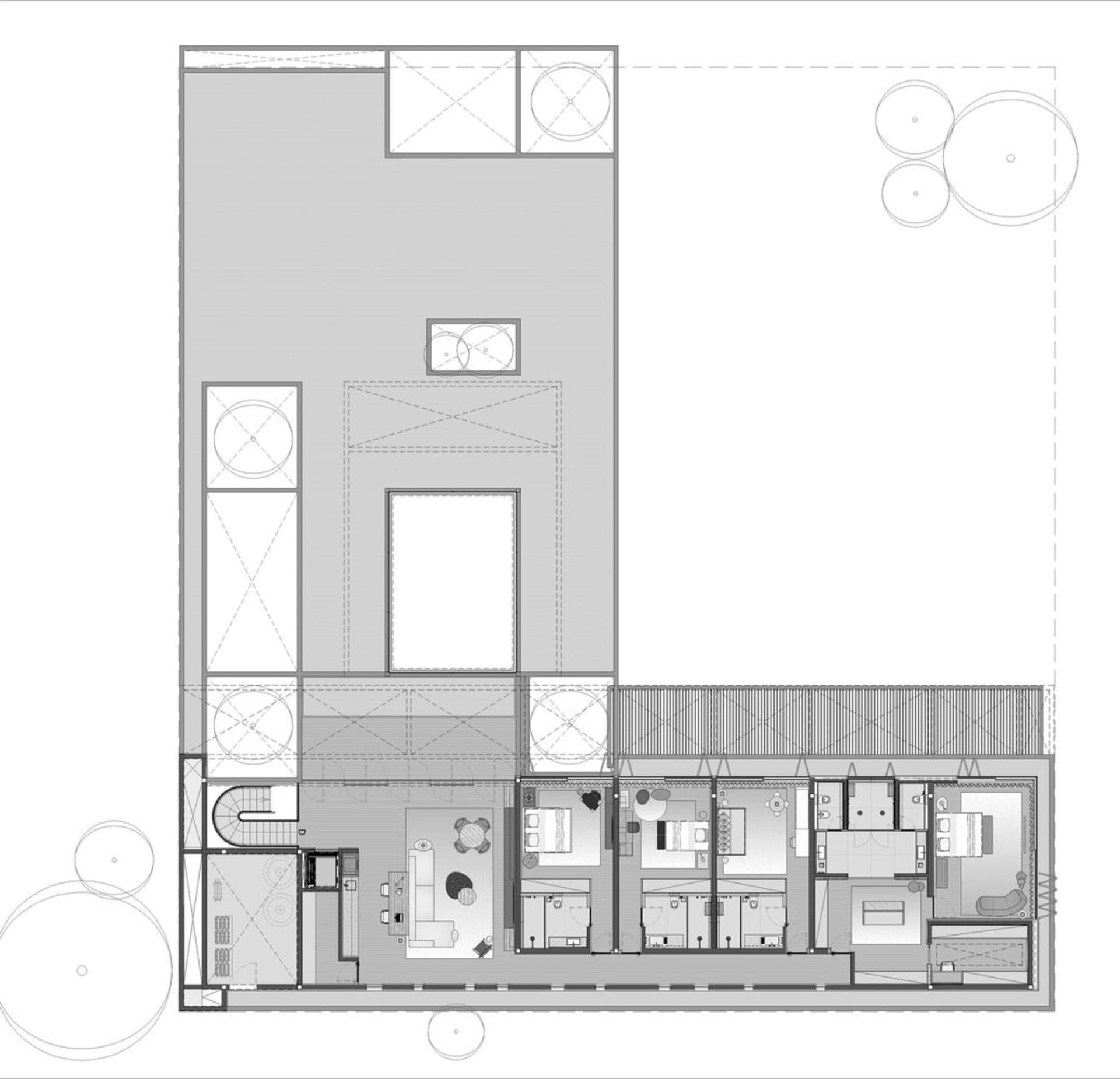 一張黑白建築圖,描繪現代住宅平面配置,置於紙面上