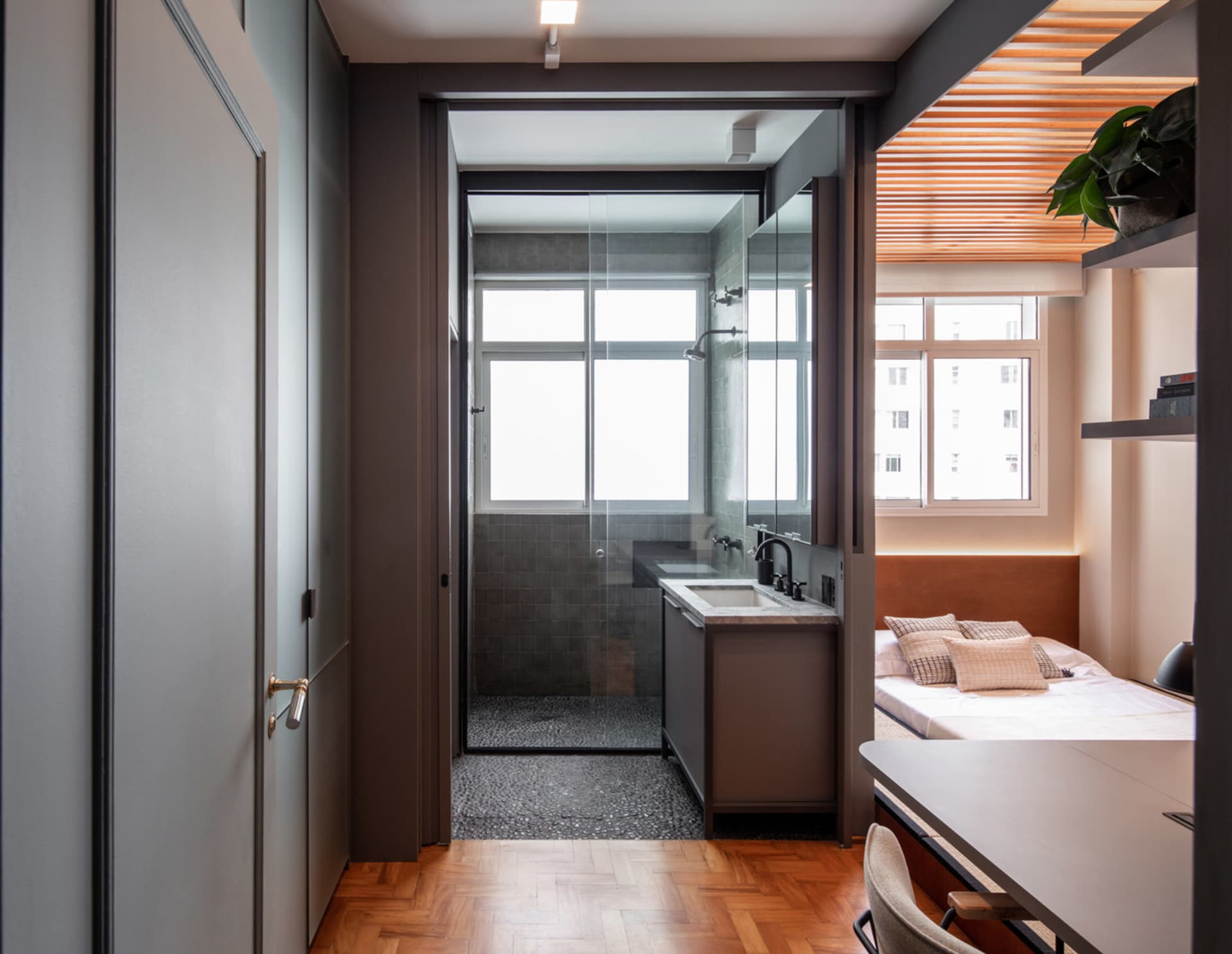 A modern, minimalist bedroom featuring industrial elements and a contemporary design.