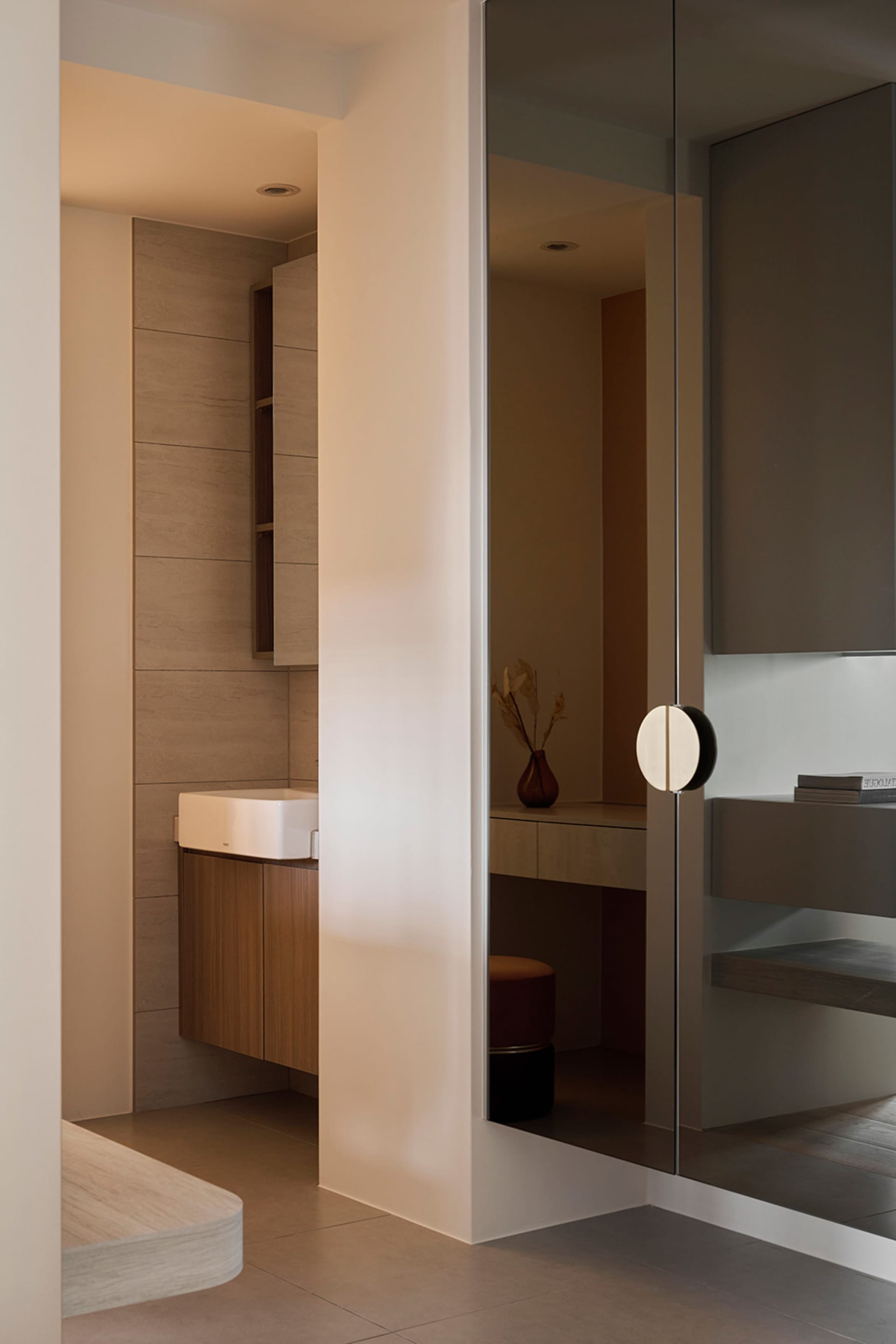 Minimalist modern bathroom with sleek white tiles and wooden vanity