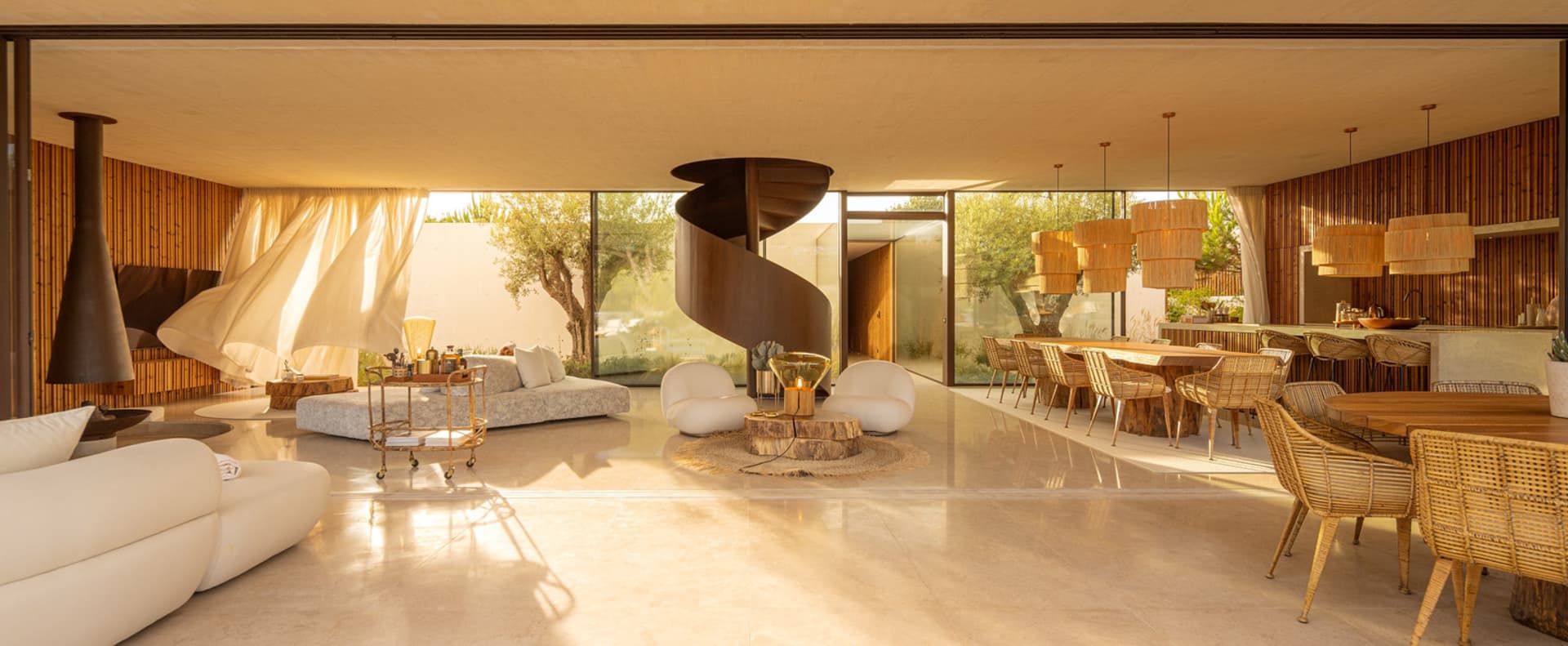 Modern living room with spiral staircase and wooden furnishings.
