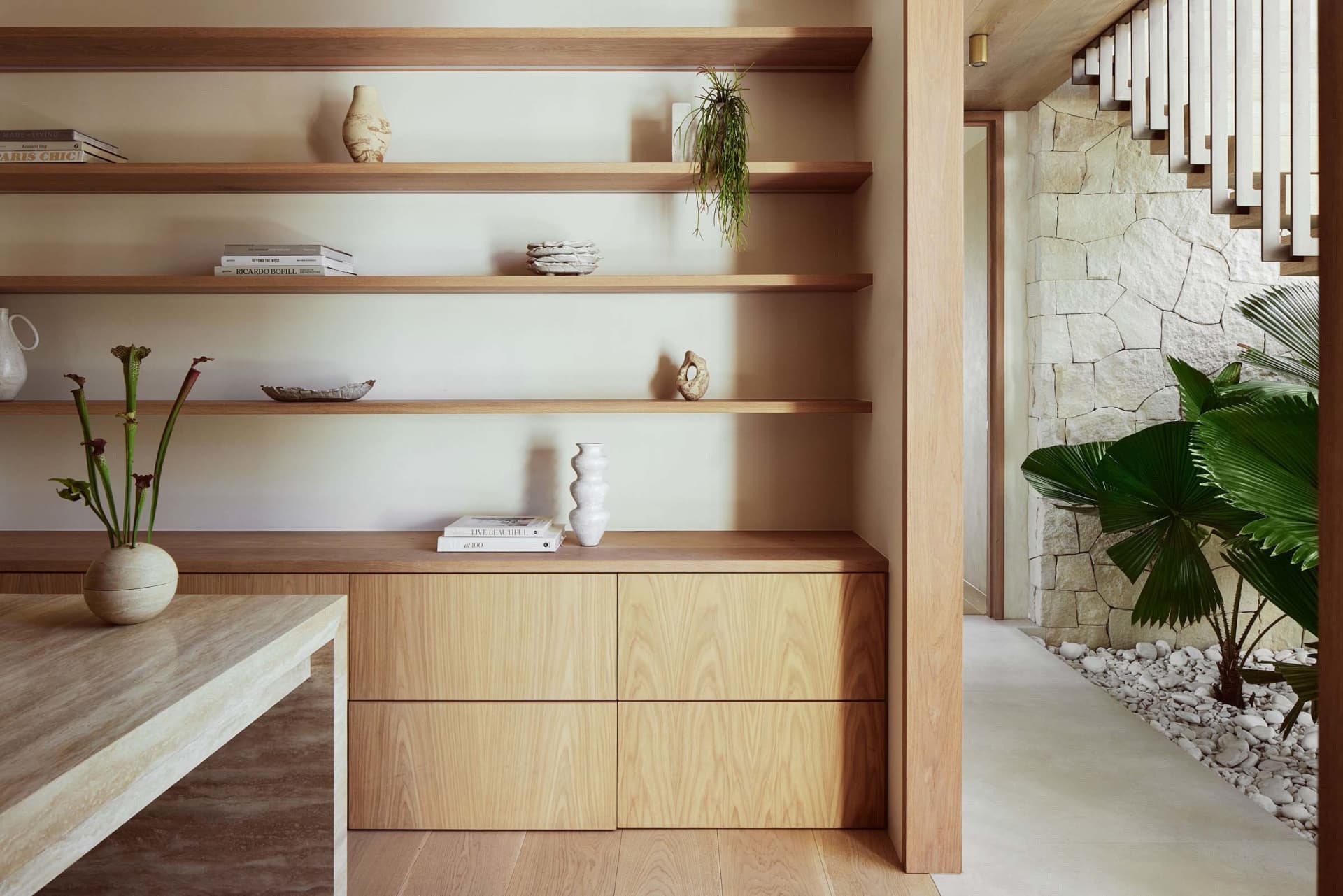 Minimalist living room featuring marble and concrete elements