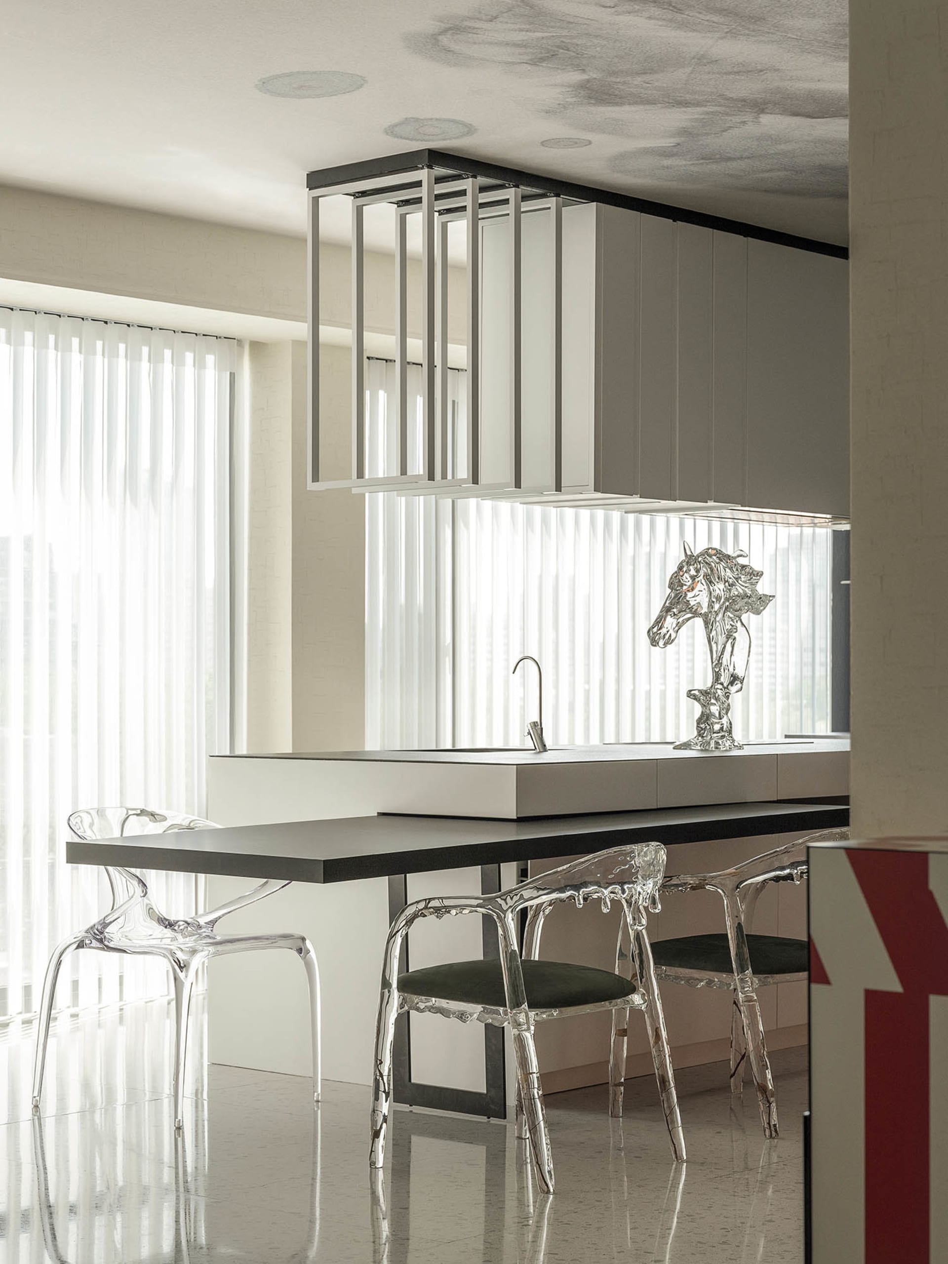 Modern kitchen featuring polished concrete surfaces and minimalist design.