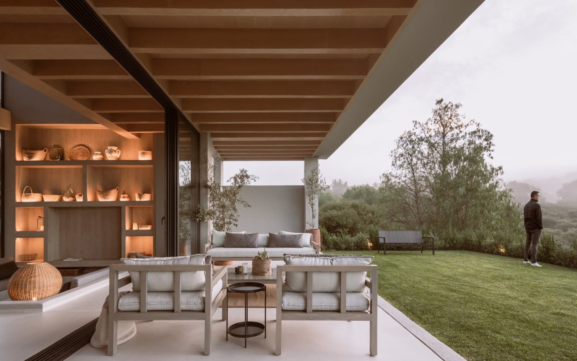 A modern living room extension featuring wooden furniture and a cozy atmosphere.