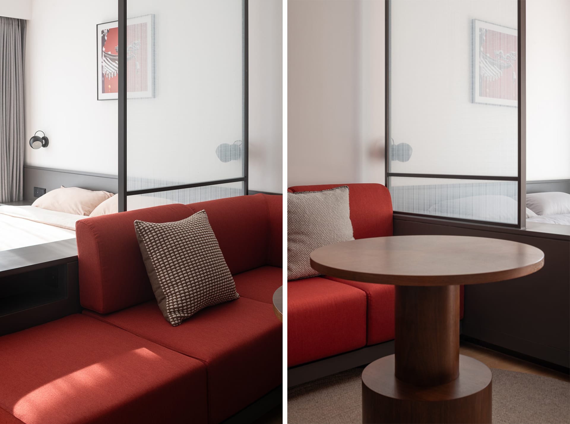 A modern interior with a red couch, pillows, and a wooden table.
