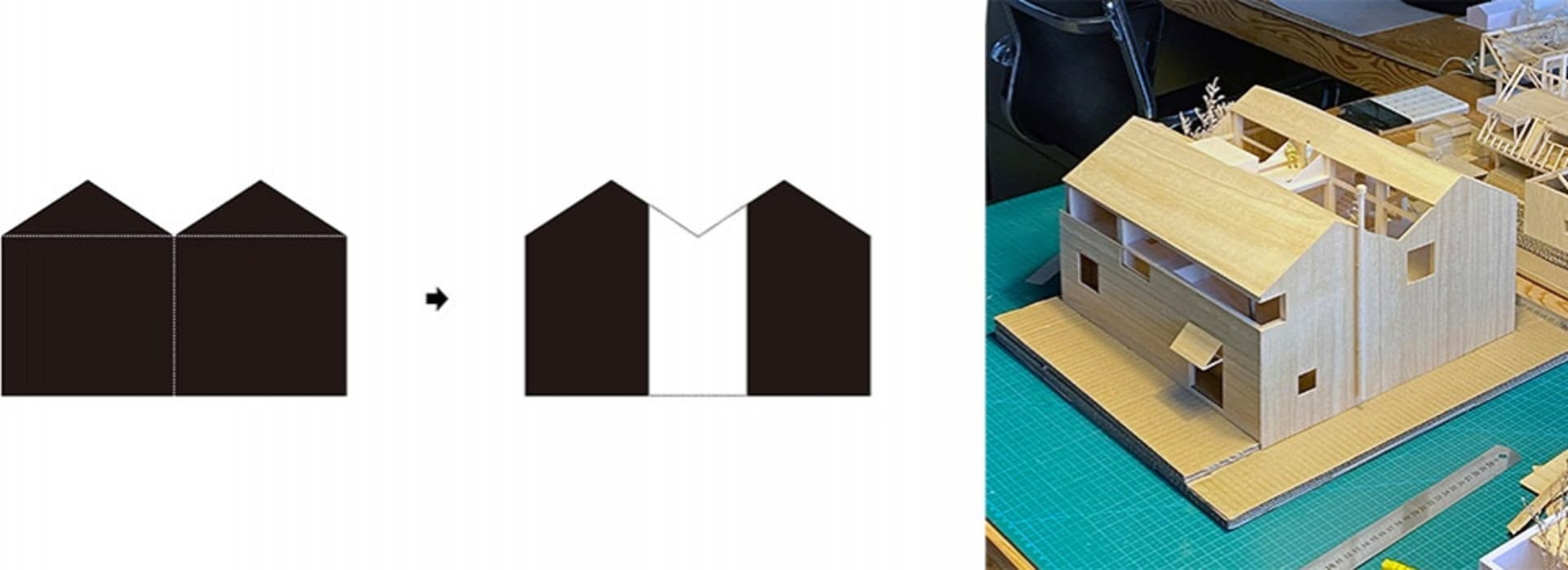 A wooden architectural model of a house on a green cutting board.