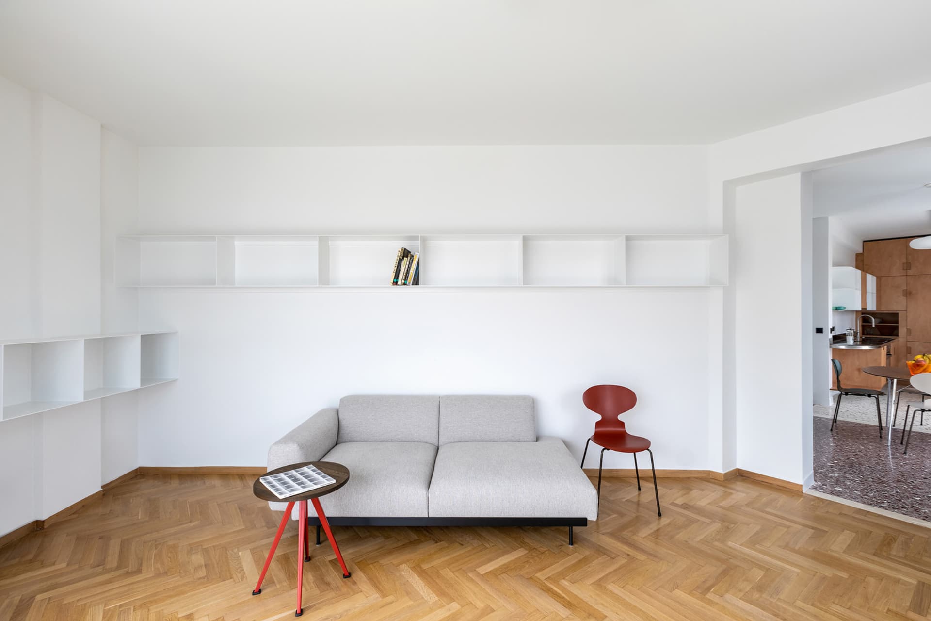 Modern living room with minimalist design featuring wooden furniture