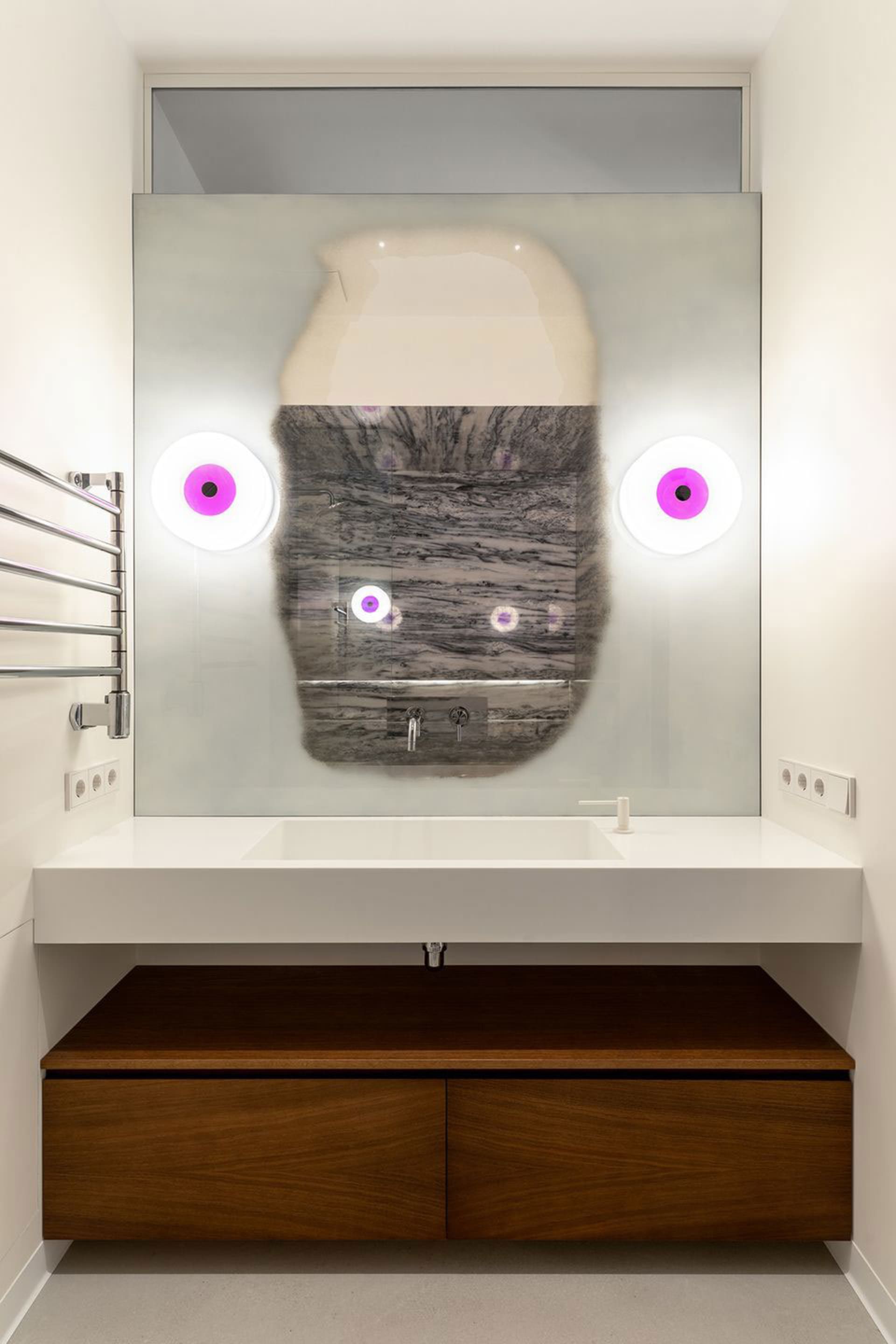 Modern minimalist bathroom featuring a glass vanity with integrated sink, wooden storage units, and a unique, abstract design