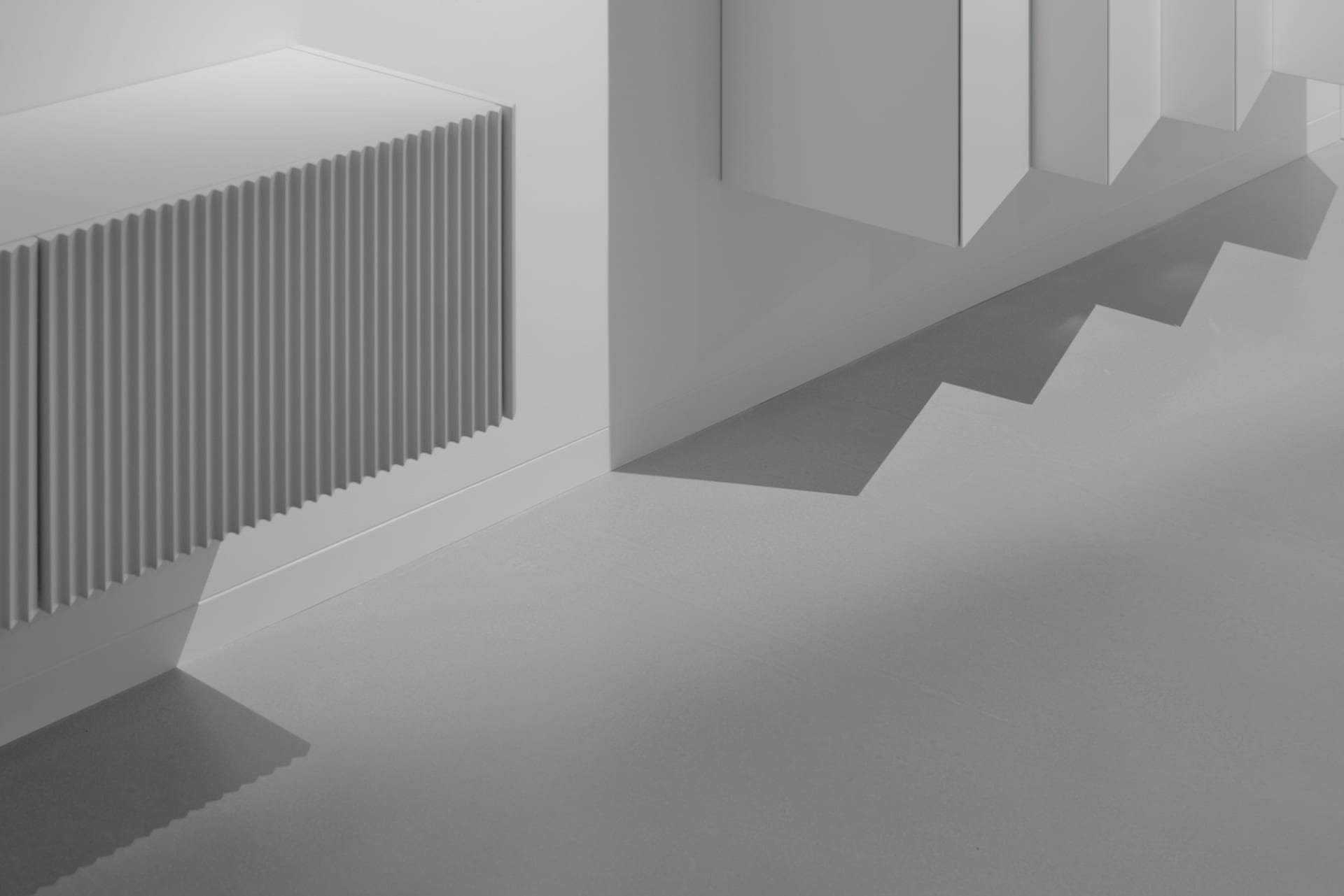 Modern interior design featuring minimalist architecture with concrete flooring and white walls.