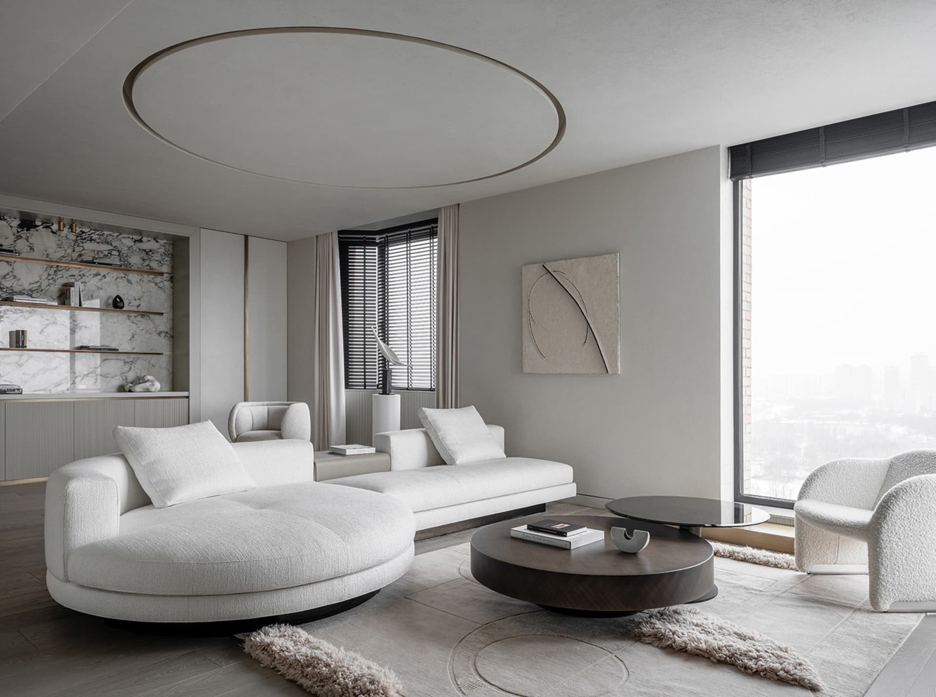 Modern minimalist living room with marble accents and white fabric furniture.