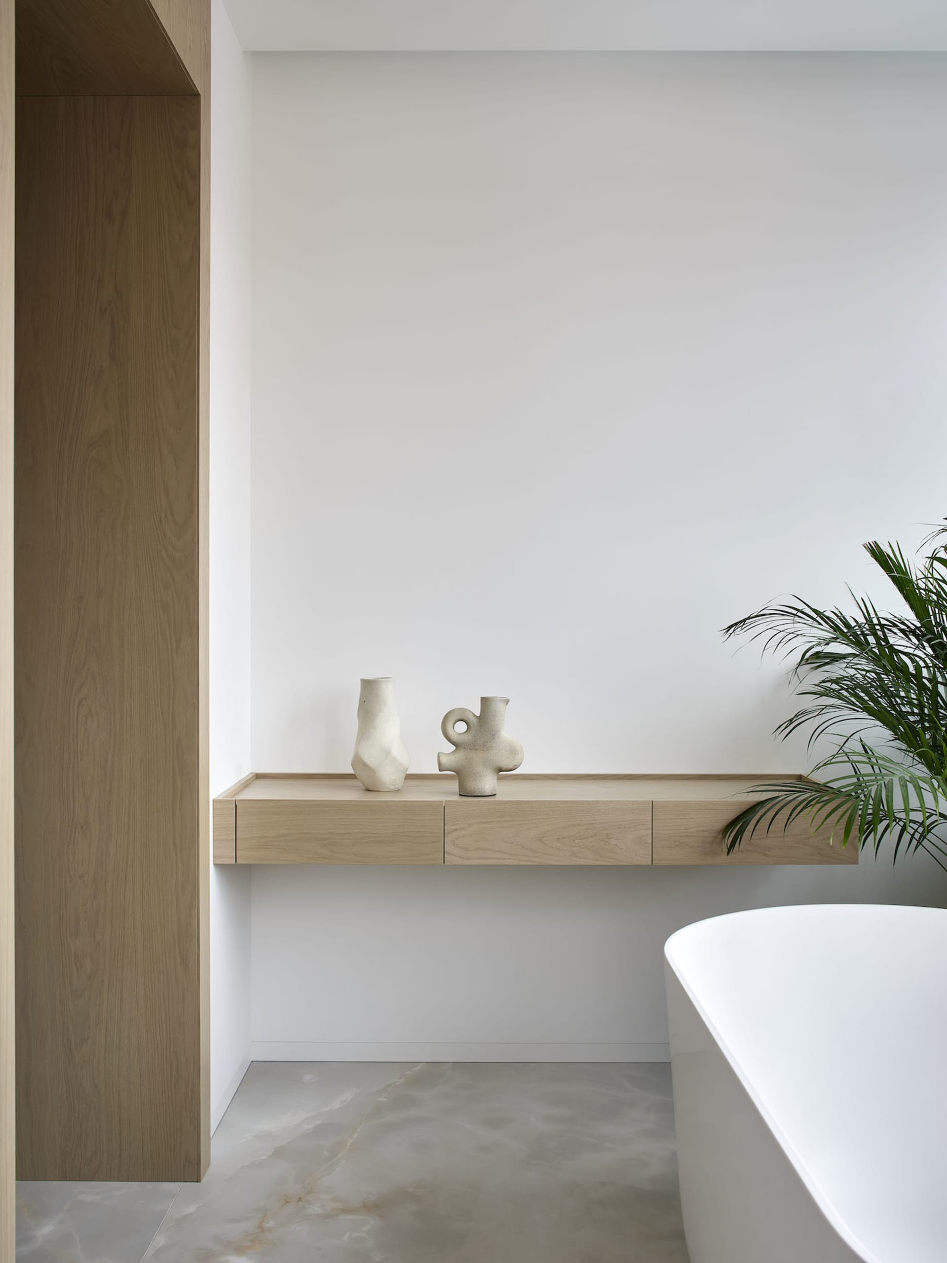 Minimalist residential bathroom with concrete and wood elements