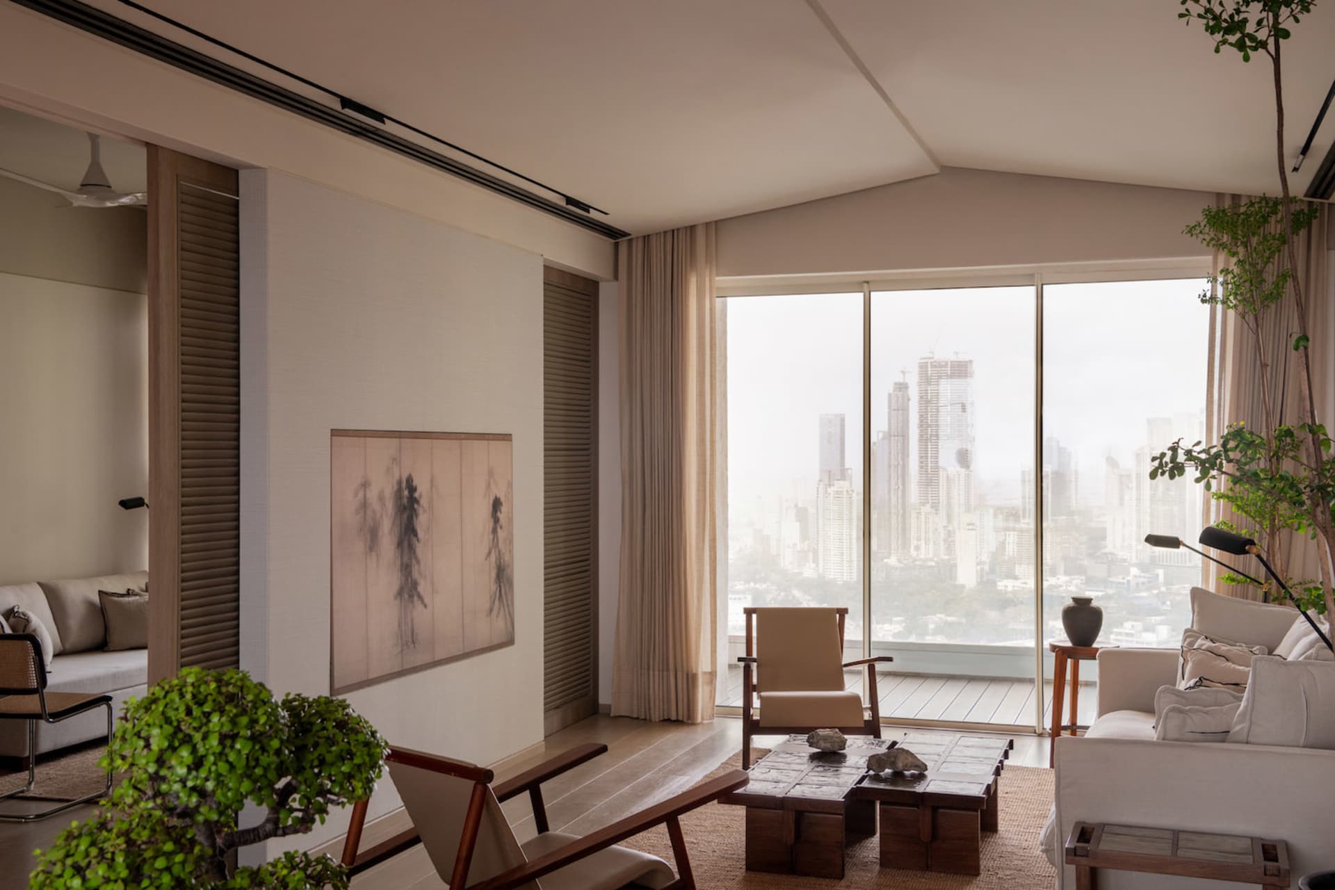 An elegantly designed modern living room featuring beige tones and soothing neutral decor, offering breathtaking panoramic ci