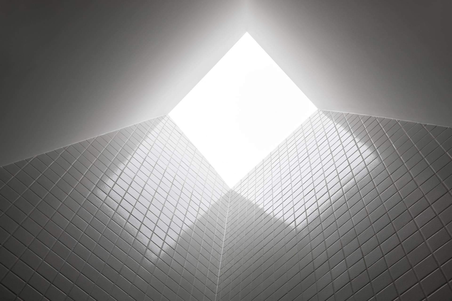 Modern architecture featuring a skylight with white tiles for natural lighting.