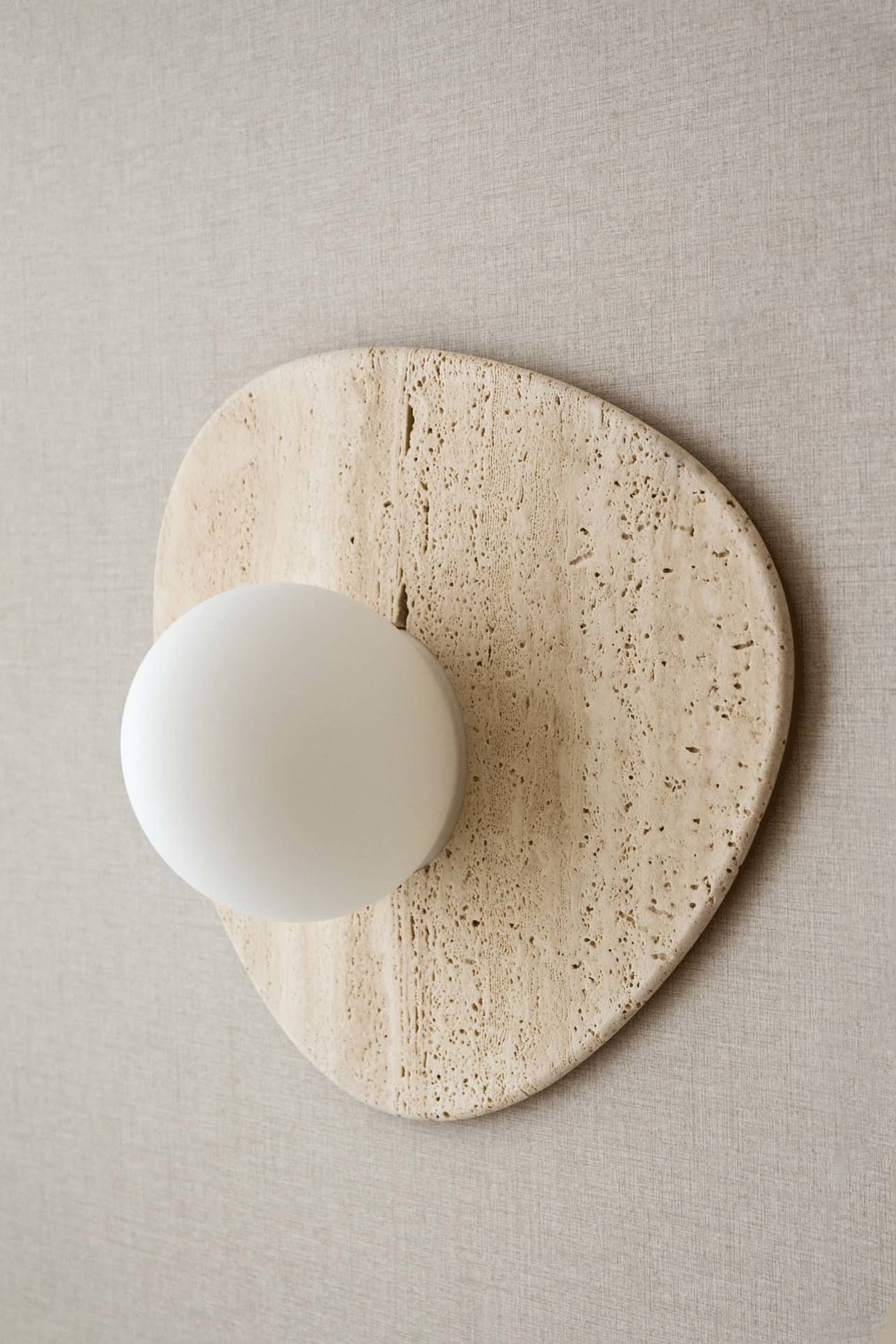 A modern industrial stone lighting fixture.