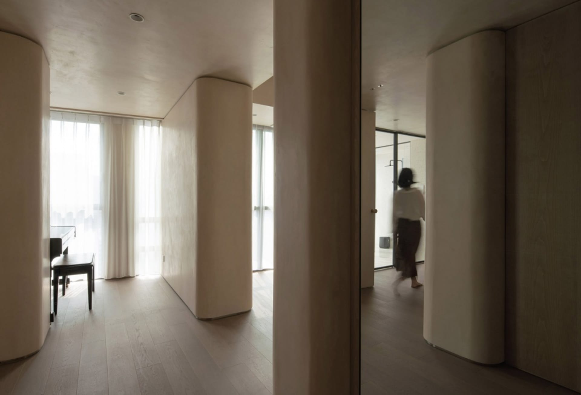 Modern residential space featuring neutral tones and minimalist design elements.