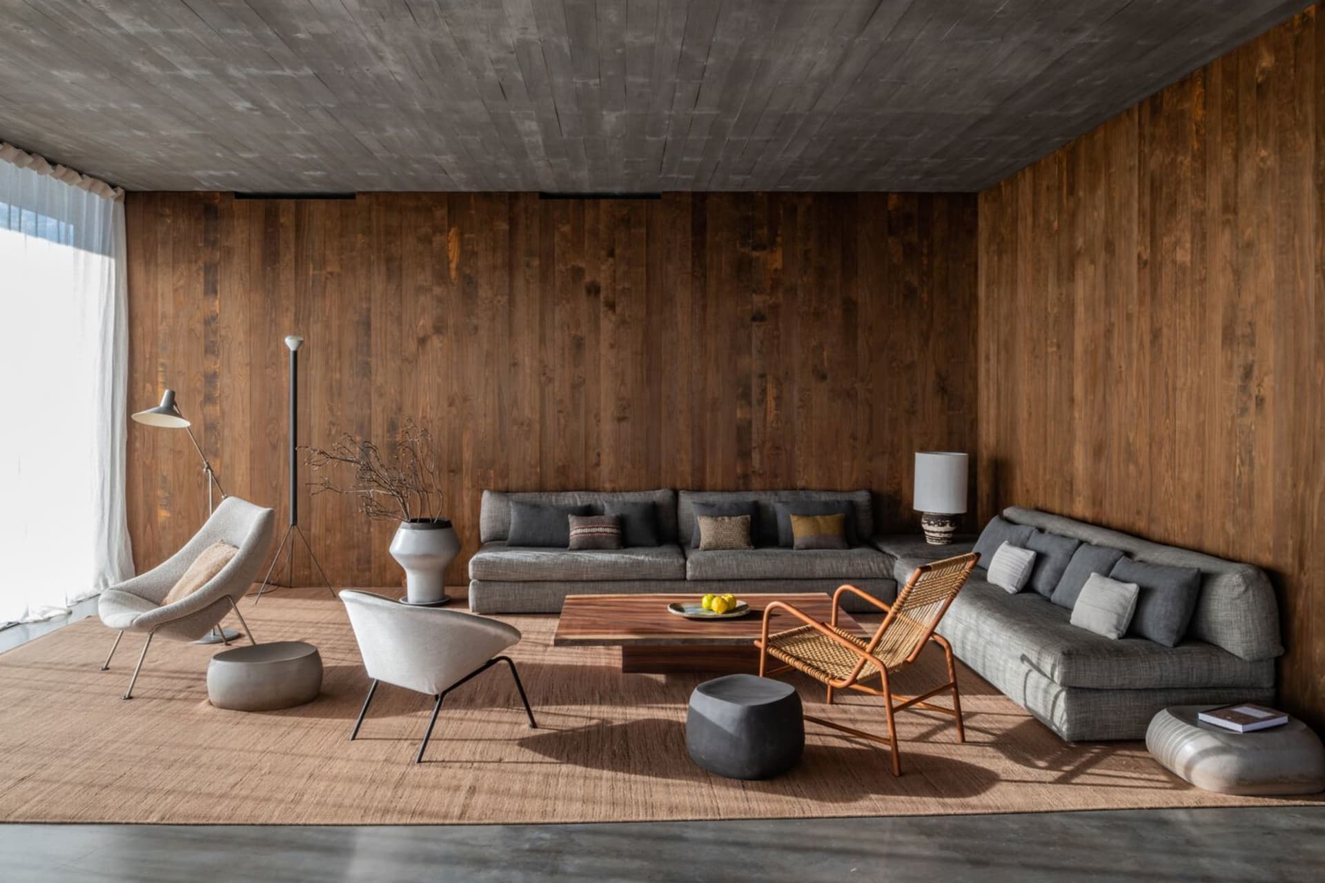 Modern living room featuring concrete and timber materials