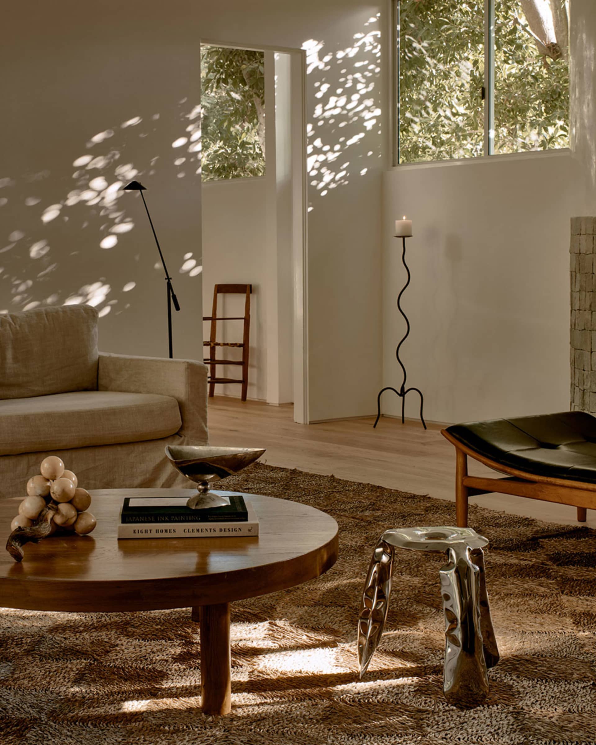A modern living room with minimalist furniture and natural light.