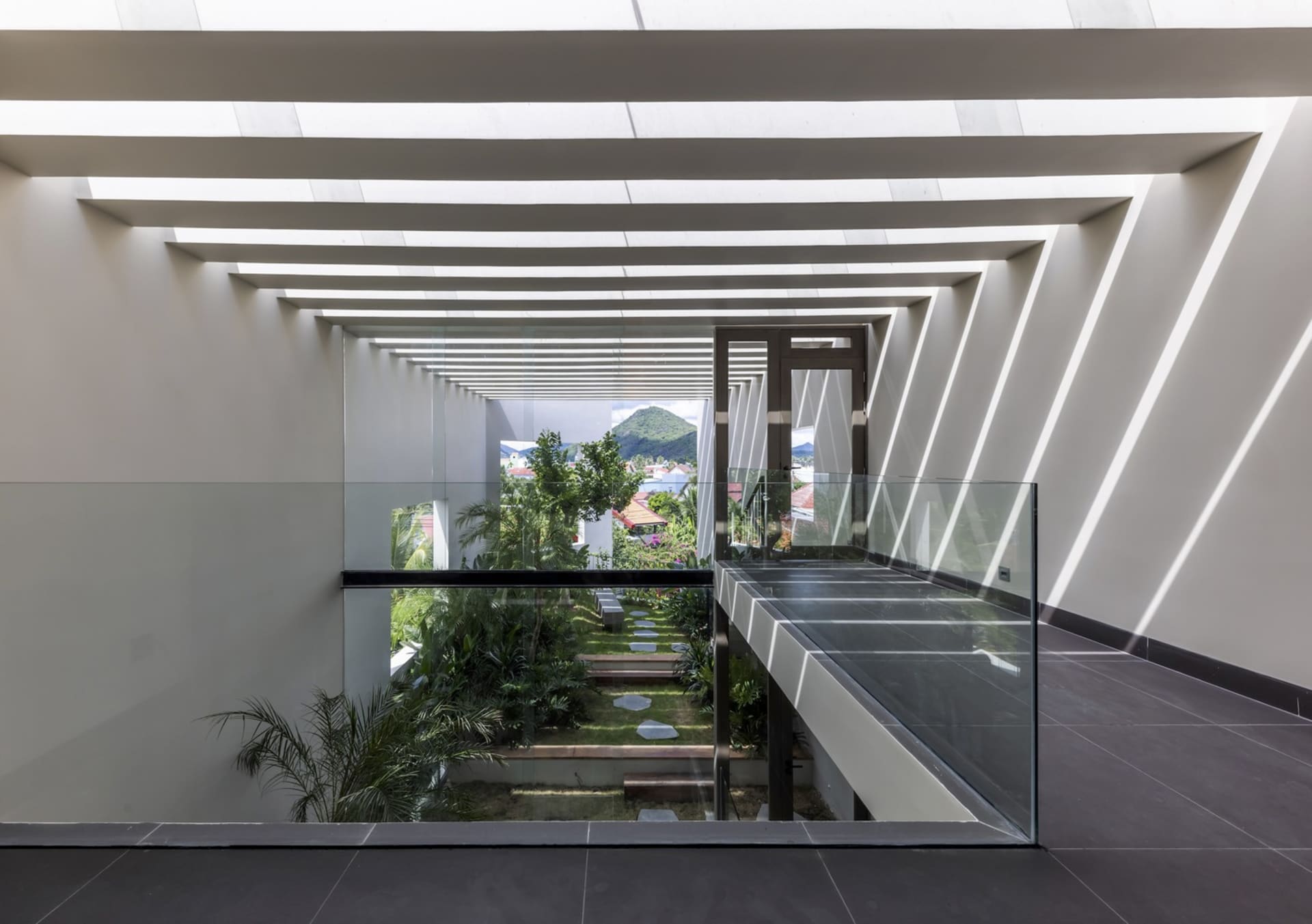 Modern interior space with glass walls and concrete floors.