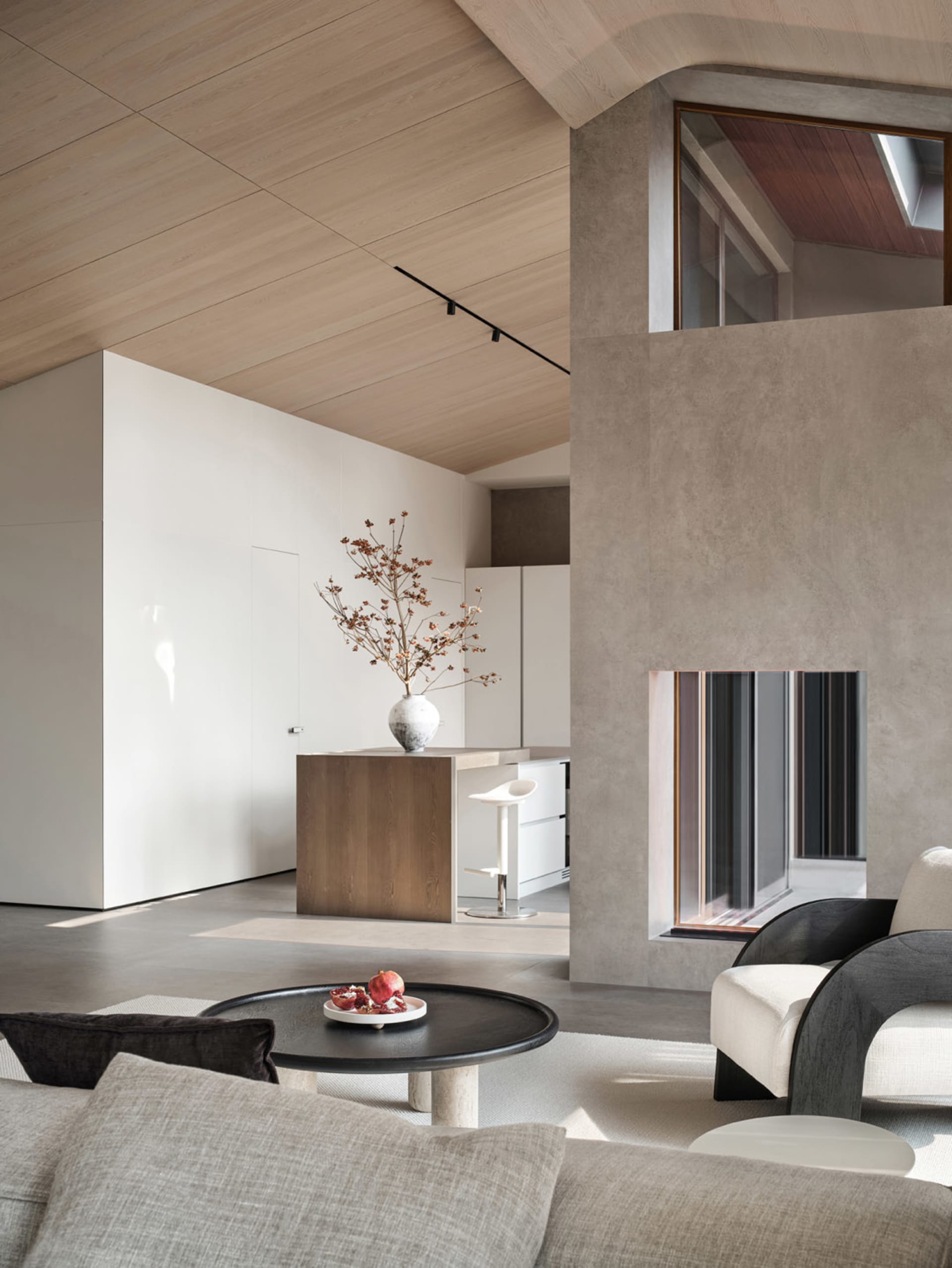 Modern living room featuring concrete and wooden elements.